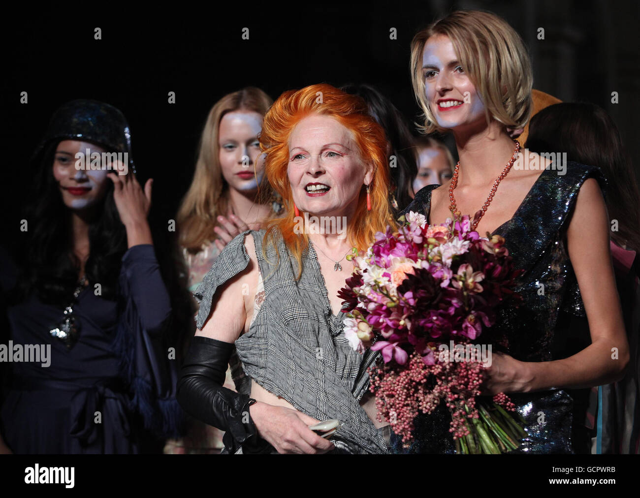 Vivienne Westwood on the catwalk with model Jacquetta Wheeler after her Spring/Summer Red Label show at London Fashion Week, London. Stock Photo