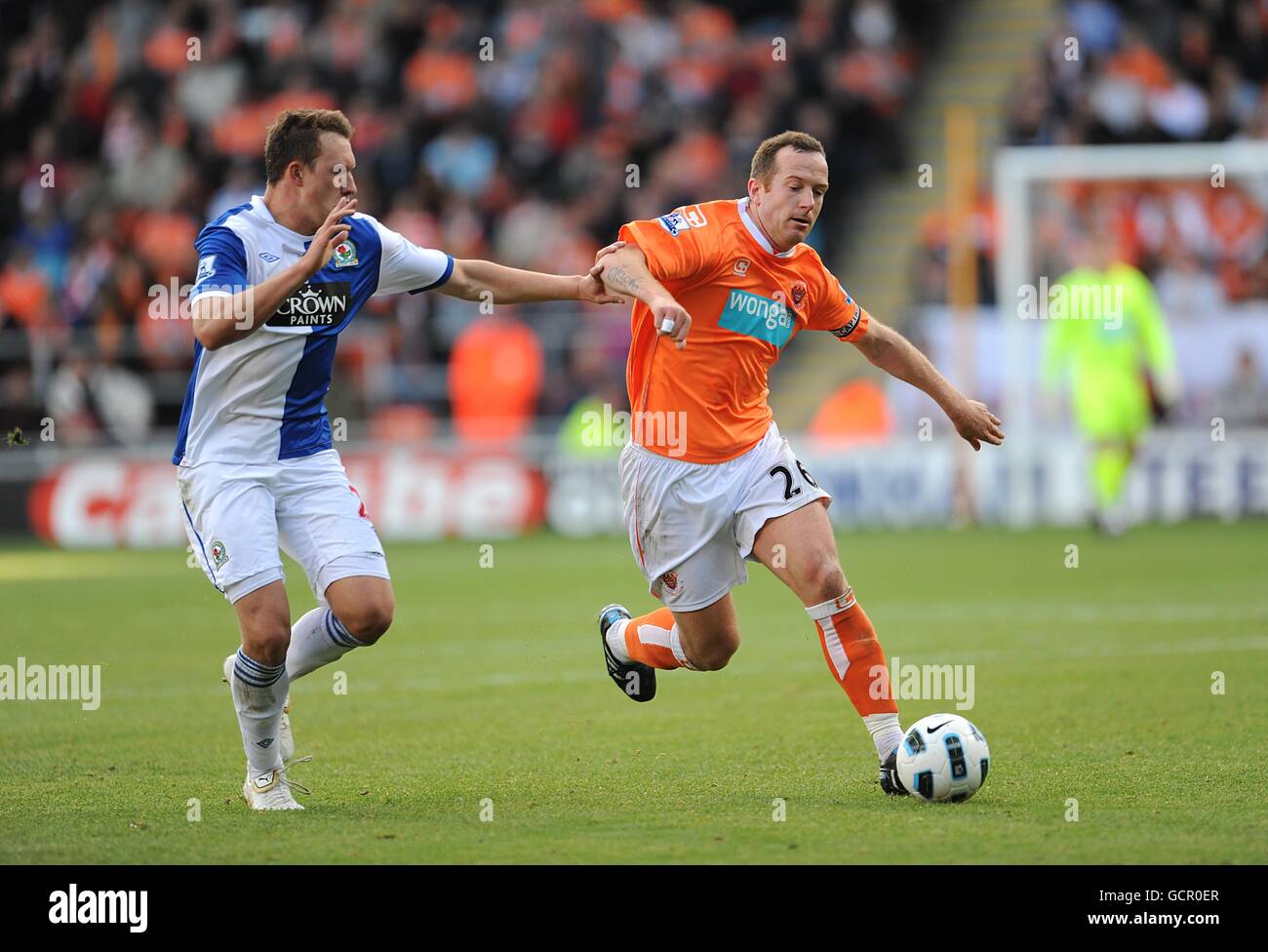 Blackburn Rovers' Phil Jones (left) and Blackpool's Charlie Adam (right ...