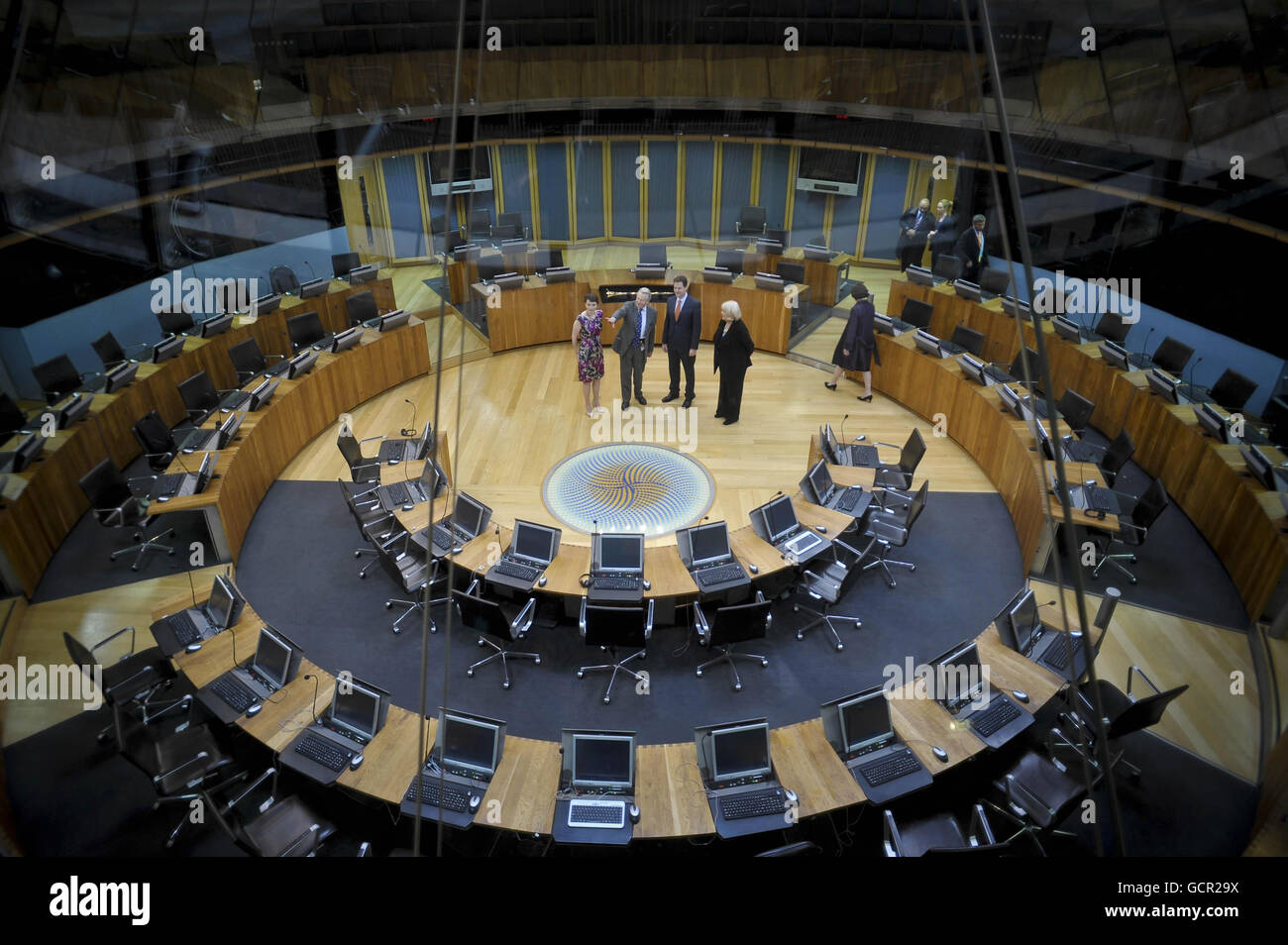 The Deputy Prime Minister Nick Clegg (2nd right) is shown the inside of the Siambr, where the Welsh Assembly sit, with Welsh Liberal Democrat leader Kirsty Williams (left), Presiding Officer of the National Assembly of Wales Lord Dafydd Elis-Thomas (second left) and the Secretary of State for Wales Cheryl Gillan (right). Stock Photo