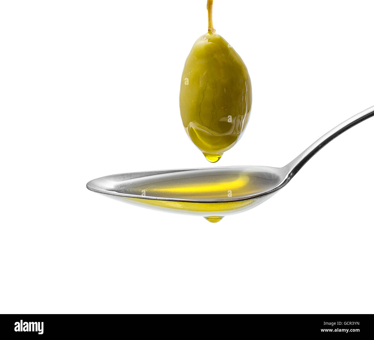 Green olive on stalk with full oil spoon, isolated Stock Photo