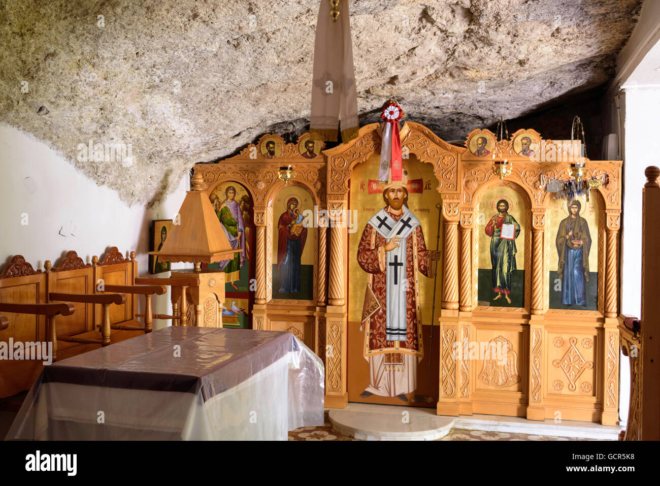 Interior of Church built into cliff face Hersonissos harbour Crete Greece Stock Photo