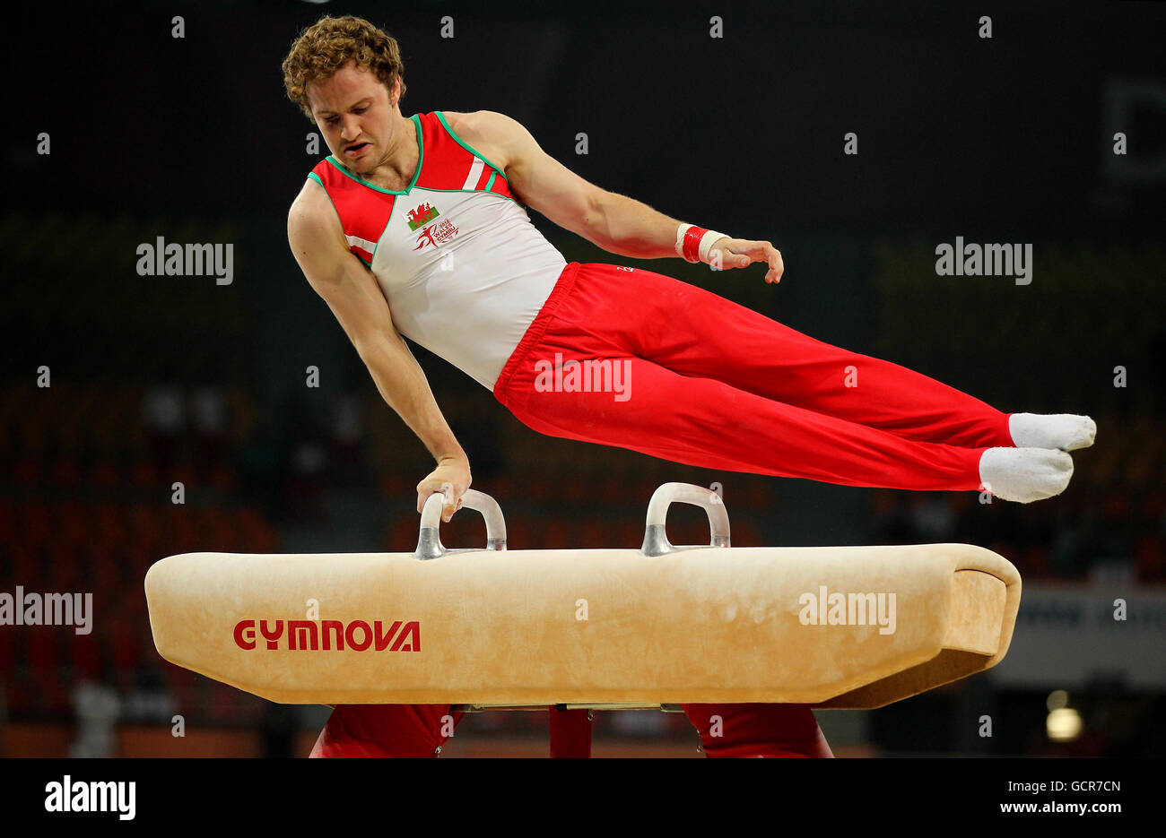 Wales' Clinton Purnell in action on the Pommell Horse in the Men's Artistic Gymnastics during Day One of the 2010 Commonwealth Games at the Indira Gandhi Arena in New Delhi, India. Stock Photo