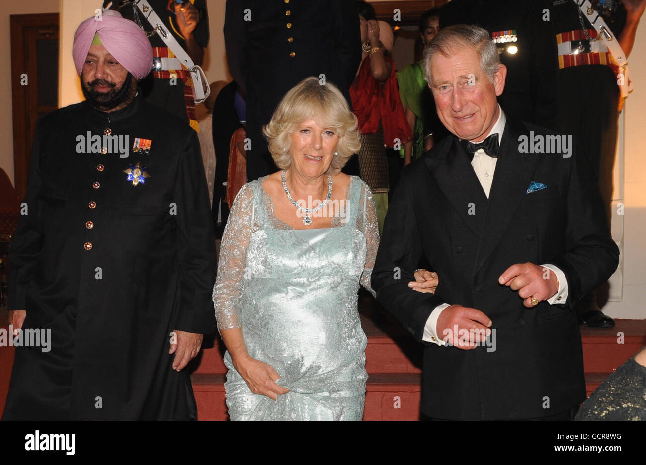 The Prince of Wales and Duchess of Cornwall arrive with Maharaja of Patiala, Captain Amarinder Singh (left), at the Maharaja's palace in Patialia, India. Stock Photo