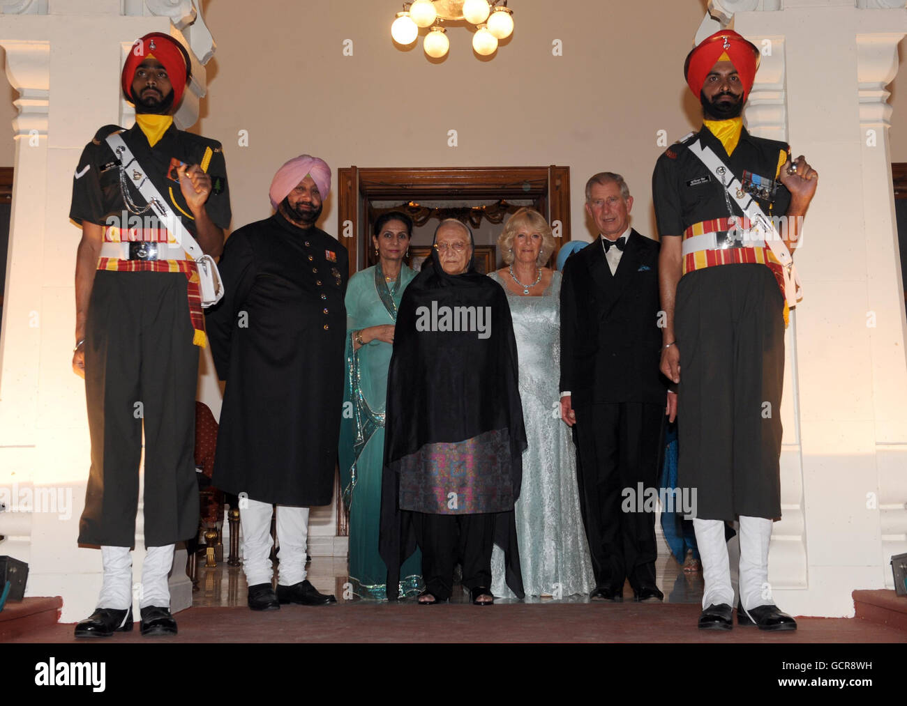 The Prince of Wales and Duchess of Cornwall arrive at the Maharaja's palace (left to to right) Maharaja of Patiala Captain Amarinder Singh, Maharani of Patiala Preneet Kaur, the Maharaja's mother, (name not given), the Duchess of Cornwall and the Prince of Wales) in Patialia, India. Stock Photo