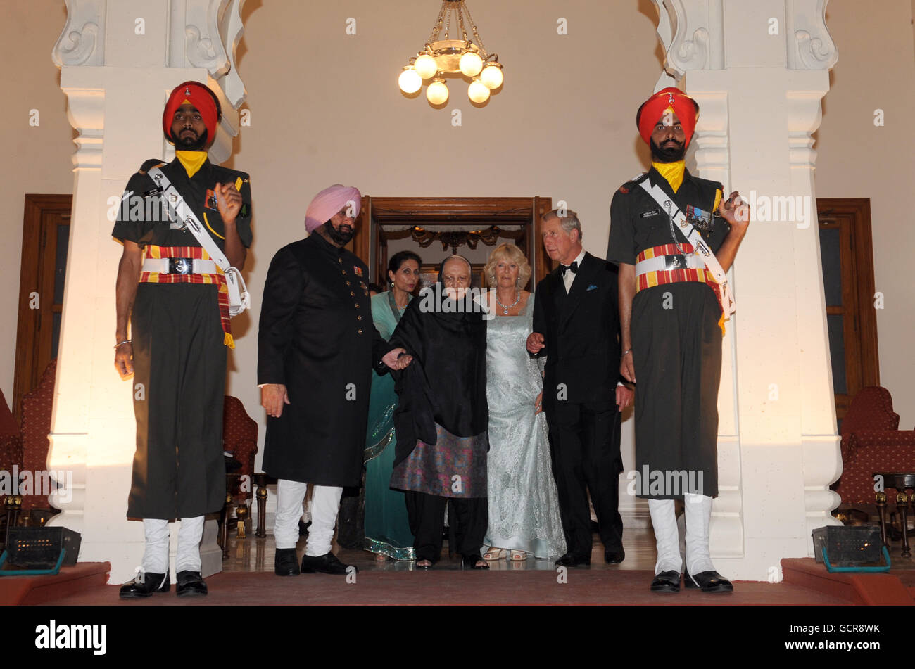 The Prince of Wales and Duchess of Cornwall arrive at the Maharaja's palace (left to to right) Maharaja of Patiala Captain Amarinder Singh, Maharani of Patiala Preneet Kaur, the Maharaja's mother, (name not given), the Duchess of Cornwall and the Prince of Wales) in Patialia, India. Stock Photo