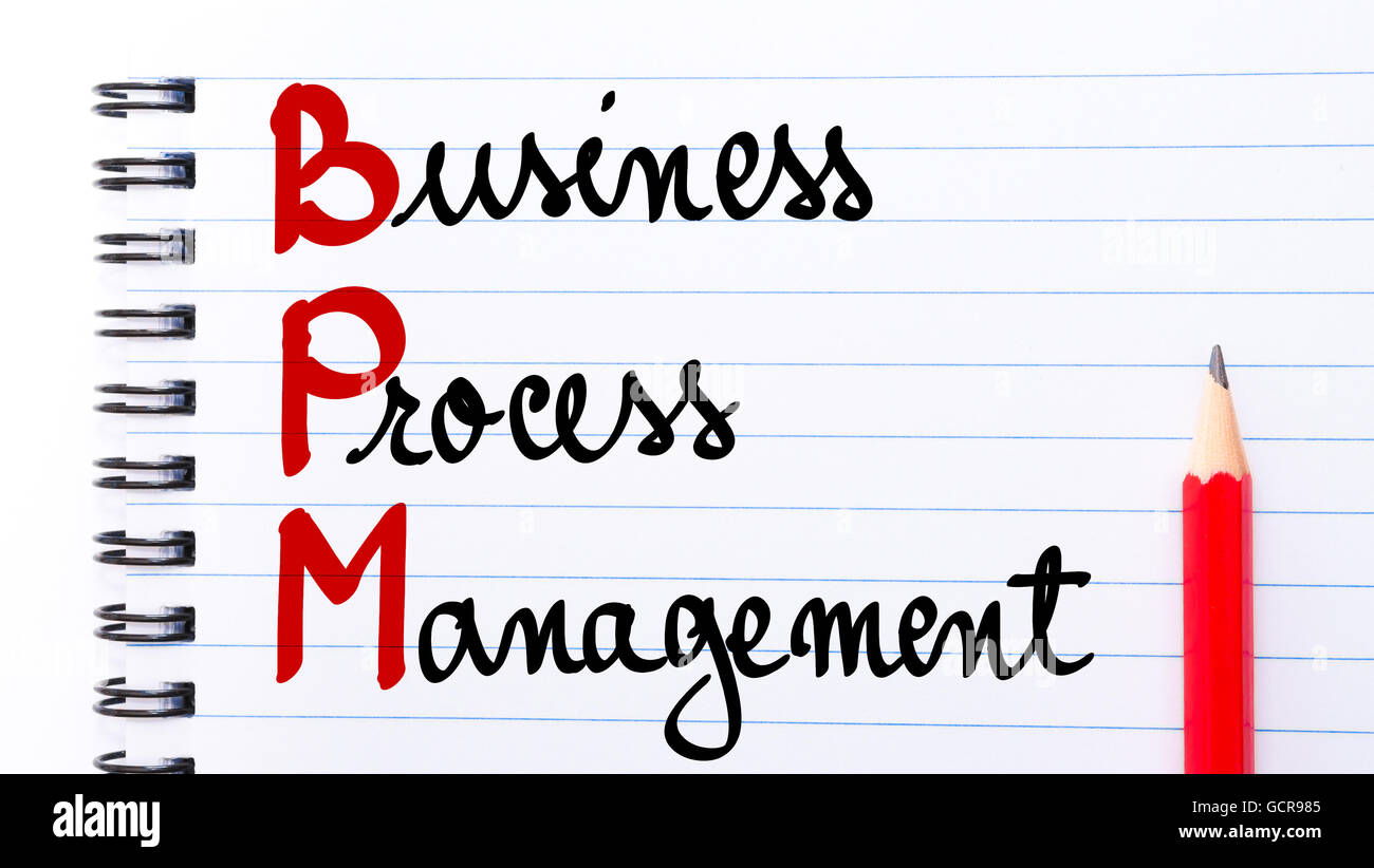 BPM Business Process Management written on notebook page with red pencil on the right Stock Photo