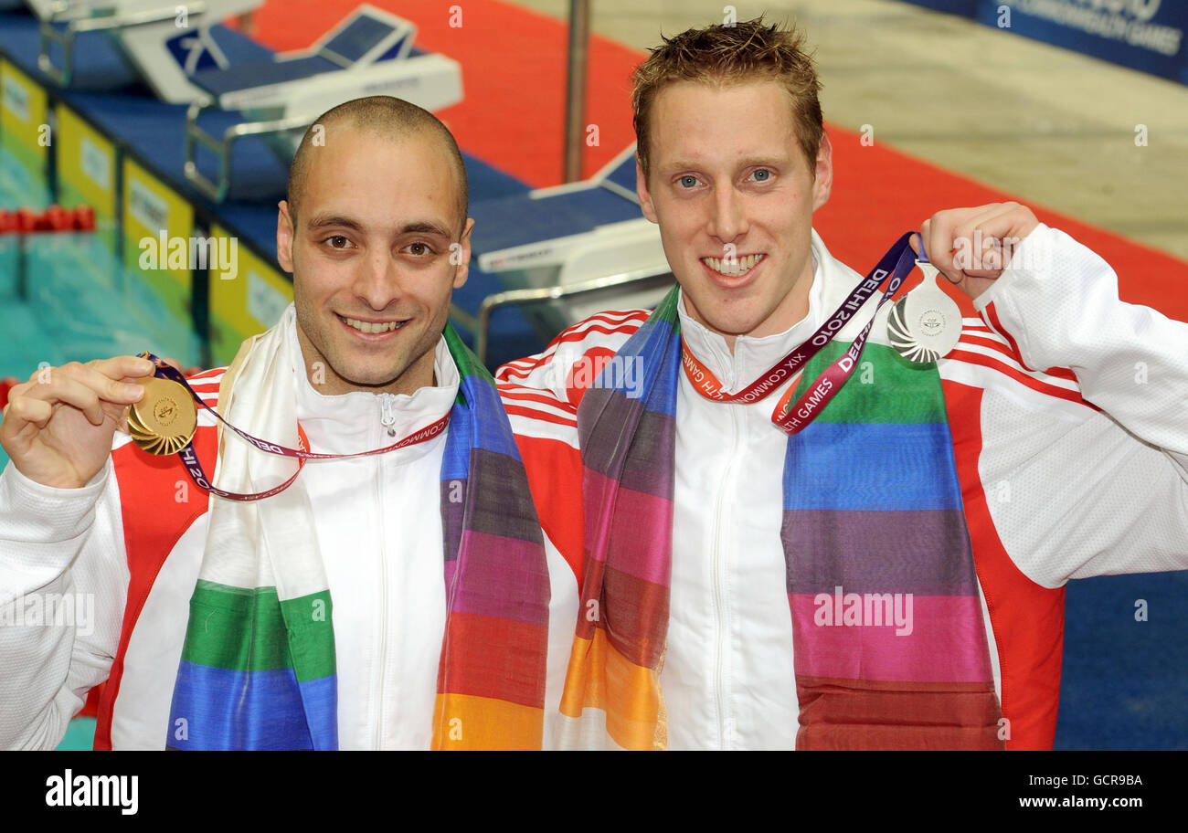 England's James Goddard celebrates winning gold (left) and Joe Roebuck celebrates winning silver in the men's 200 metre individual medley final during Day Five of the 2010 Commonwealth Games at the Dr SPM Aquatics Centre in New Delhi, India. Stock Photo