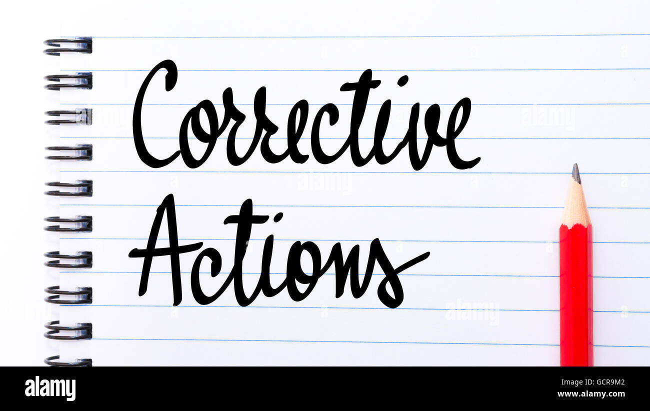 Corrective Actions written on notebook page with red pencil on the right Stock Photo