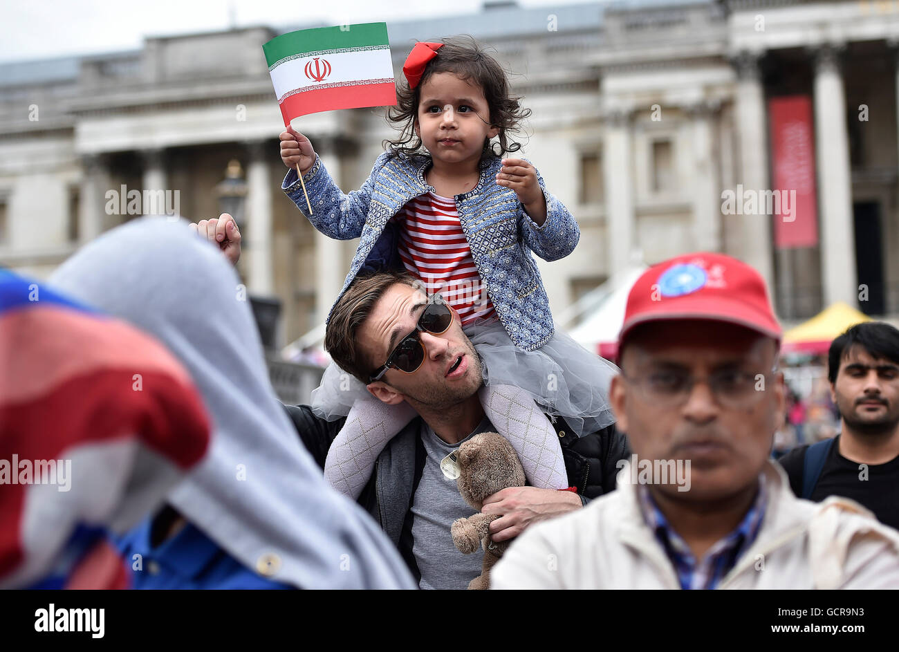 People celebrate Eid Festival in Trafalgar Square in central London, to mark the end of Ramadan, the Islamic holy month of fasting. Stock Photo