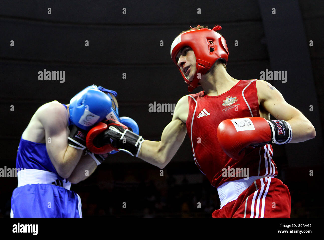 Northern Ireland's Paddy Barnes (blue) in action against Australia's Andrew  Moloney in the Light Fly weight 46-49kg at the Boxing competition on day  six of the 2010 Commonwealth Games at the Talkatora