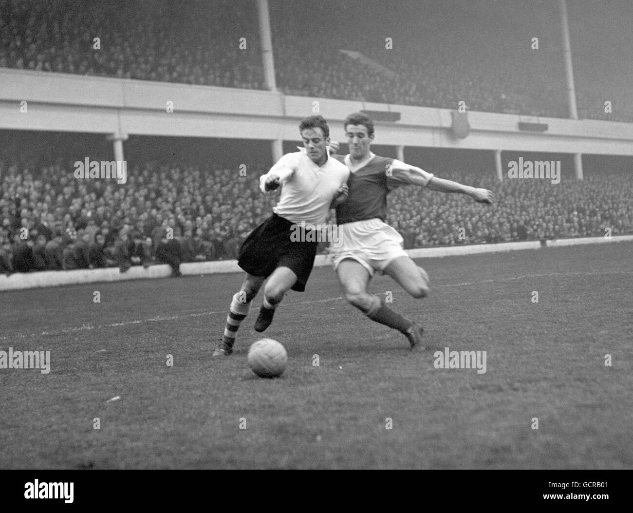 Soccer - League Division Two - West Ham v Nottingham Forest - Upton Park. West Ham's Malcolm Allison, right, in a tackle for the ball with Peter Higham. Stock Photo