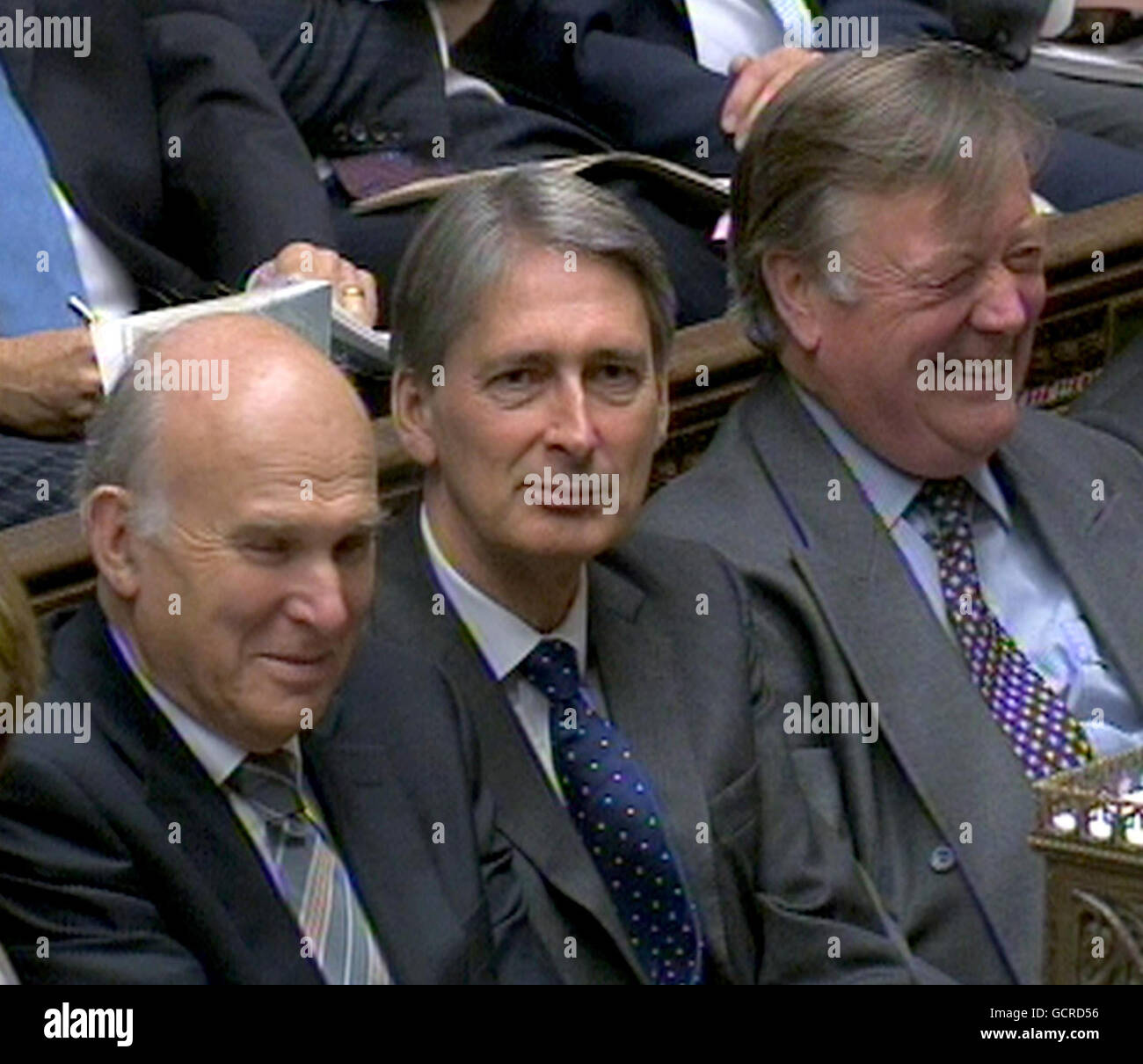 (From left to right) Business Secretary Vince Cable, Transport Secretary Philip Hammond and Justice Secretary Kenneth Clarke during Prime Minister's Questions in the House of Commons, London. Stock Photo
