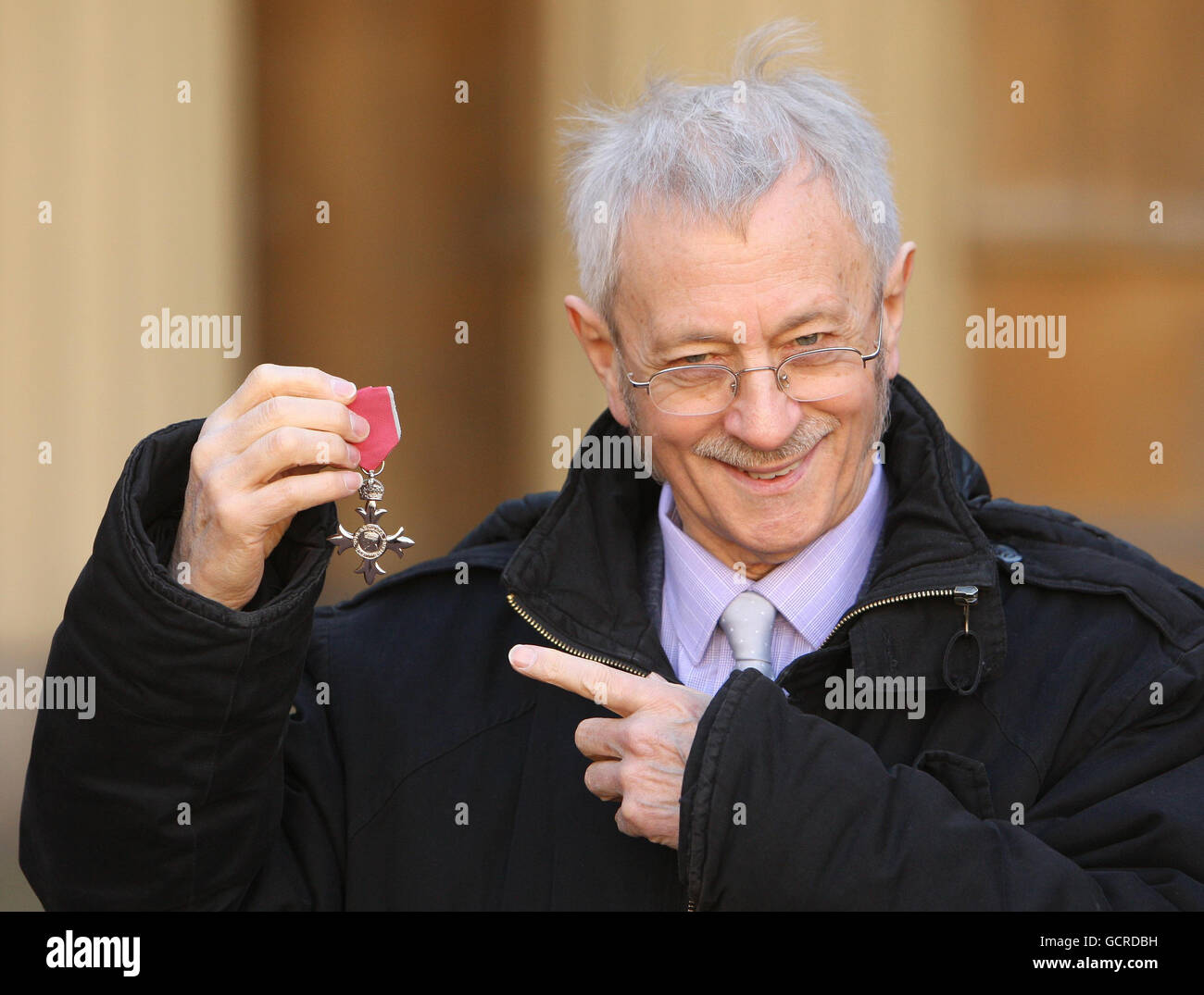 Jazz Pianist Michael Garrick with his MBE, which was awarded by Queen