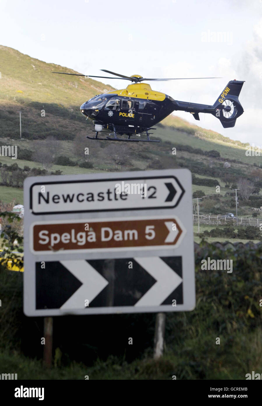 Police helicopters near the scene where a helicopter crashed in the Mourne Mountains yesterday. Stock Photo