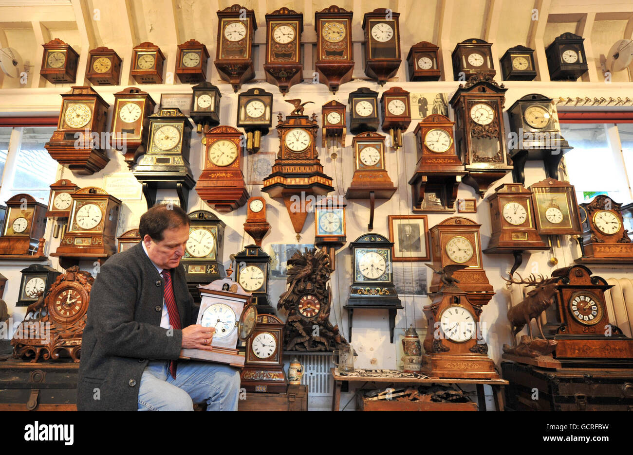 Roman Piekarski makes a start to changing the time on one of more than