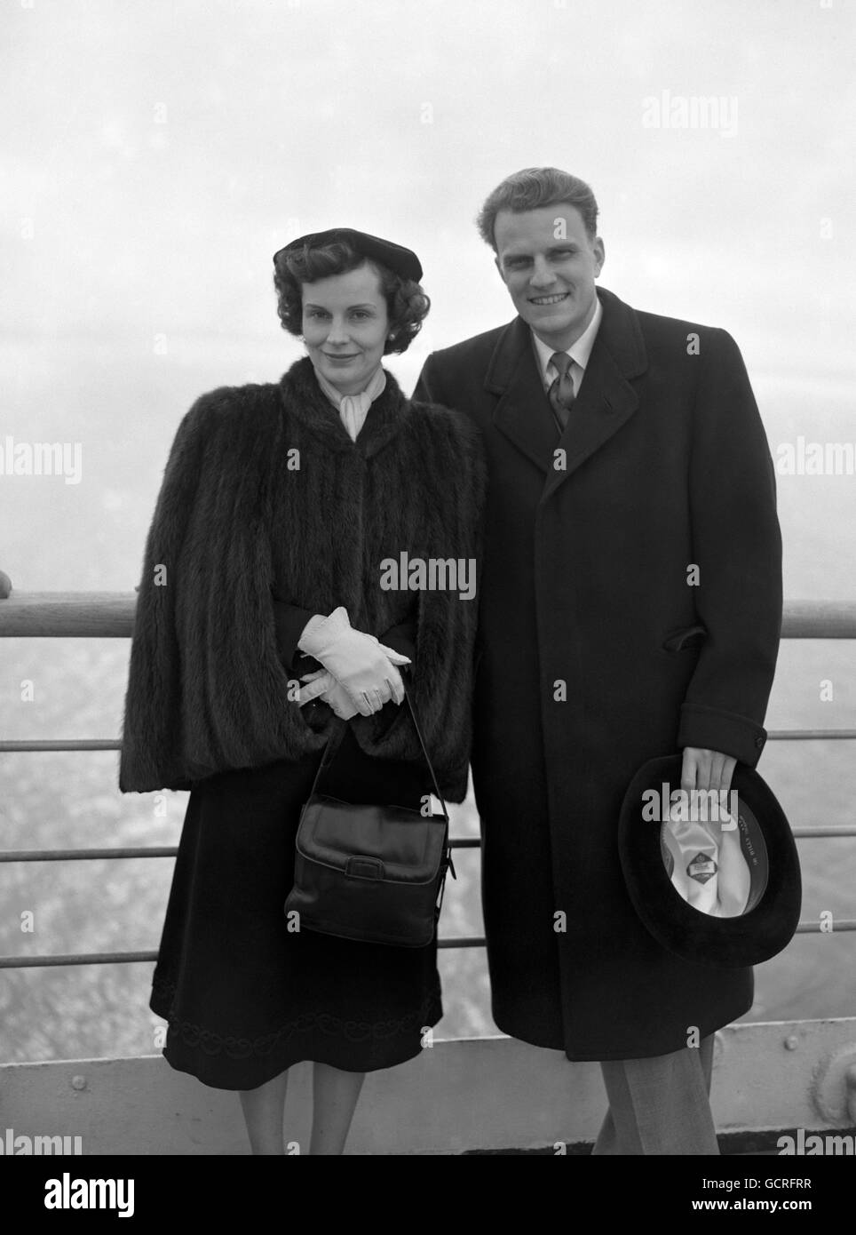 American evangelist Billy Graham, and his wife Ruth, arriving in Southampton aboard the liner Ile de France from New York. He is in Britain fir a two week investigatory tour. Stock Photo