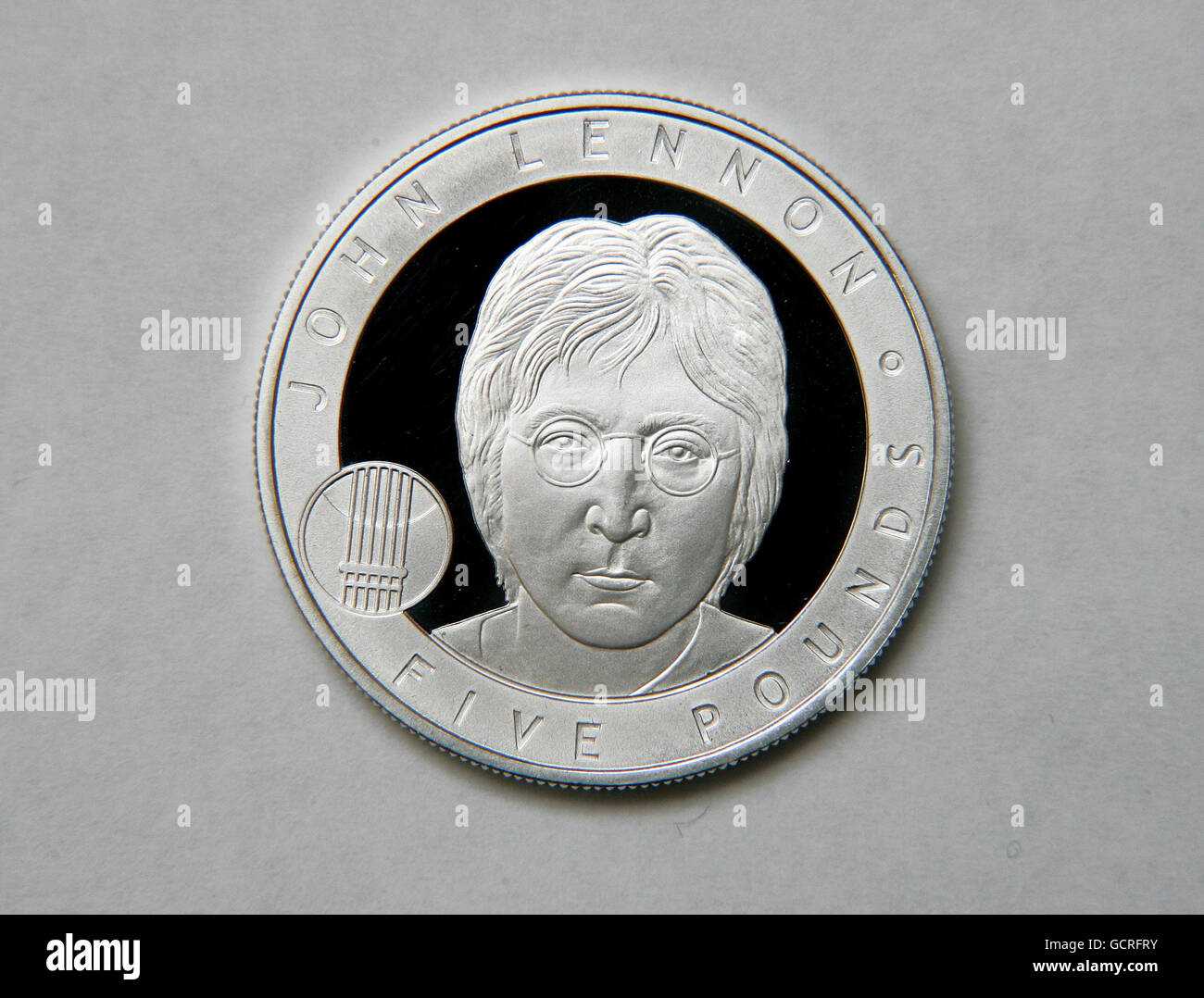 The Royal Mint's John Lennon 5 coin, which goes on sale today, after the former Beatle won a public vote to be the next Great Briton' to feature on a coin. Stock Photo