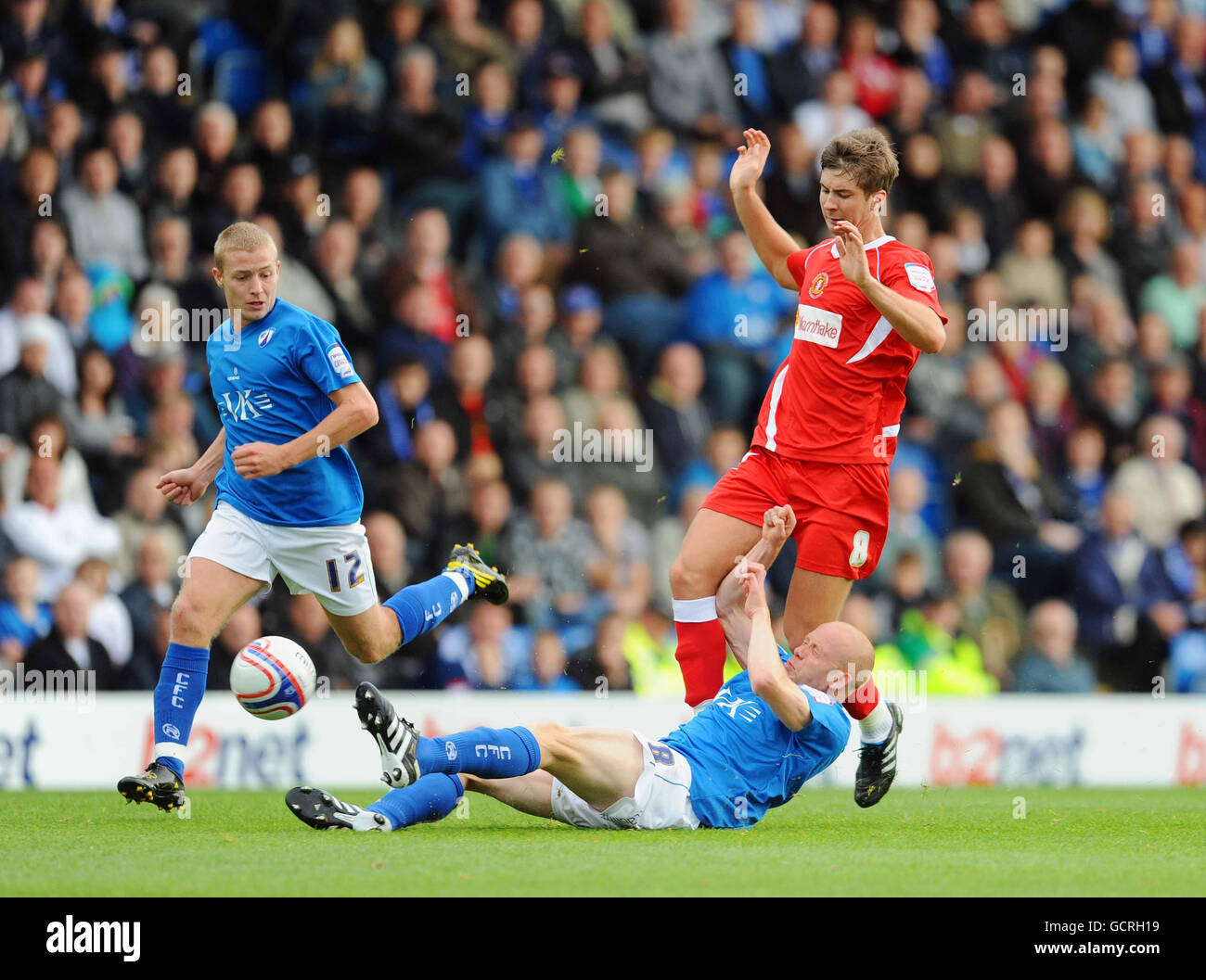 Chesterfield's Derek Niven (ground) battles for the ball with Crewe's Luke Murphy during the npower League Two match at the B2net Stadium, Chesterfield. Stock Photo