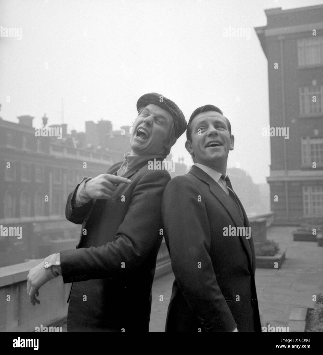 English comedian and actor Norman Wisdom (r) with The Rockin' Berries singer Clive Lea Stock Photo