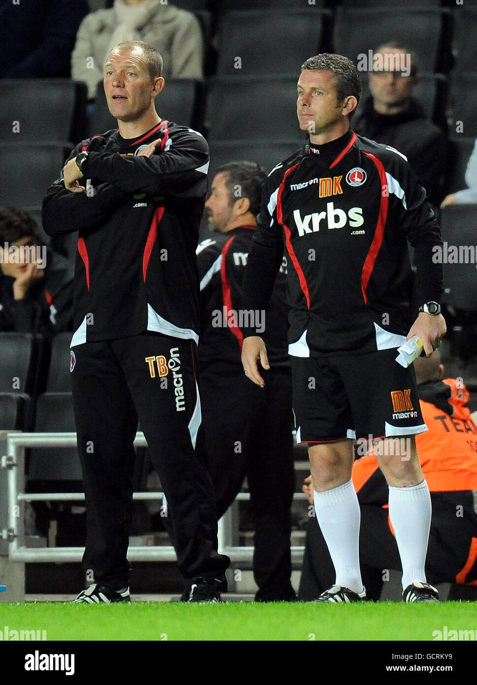 Charlton Athletic's Mark Kinsella (right) and Tim Breacker on the touchline Stock Photo