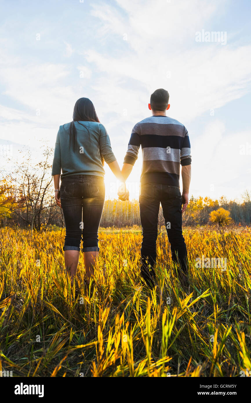 Asian couple holding hands hi-res stock photography and images - Alamy