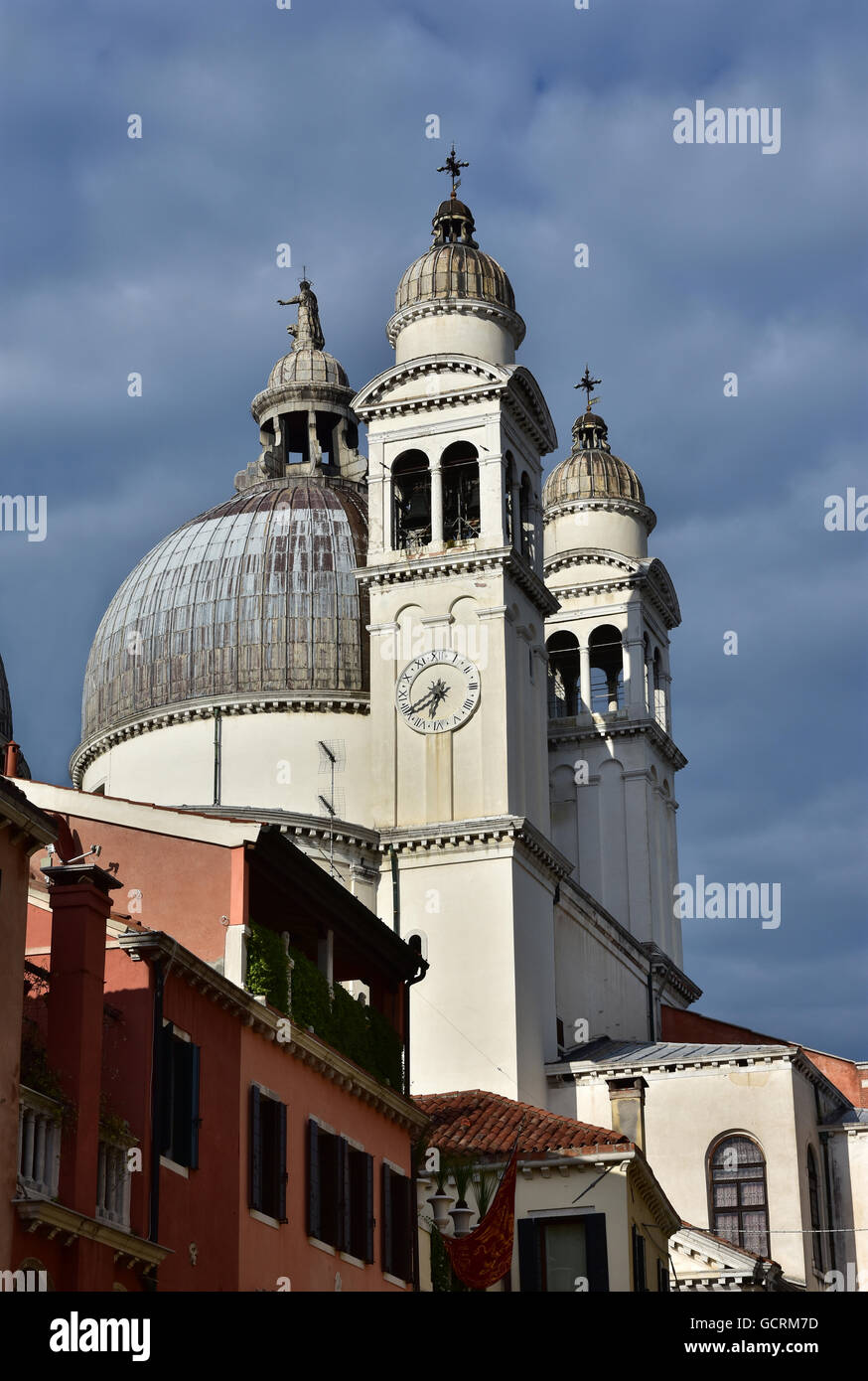 St Mary of the Health apse and belfries with cloudy sky, in Venice Stock Photo