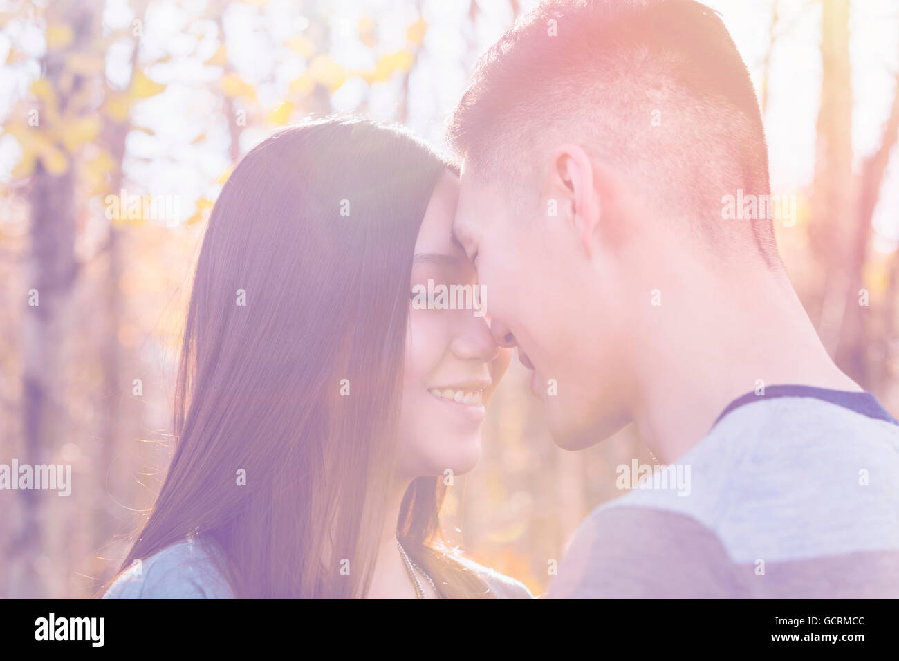 A Young Asian Couple Enjoying Quality Time Together Outdoors In A Park ...