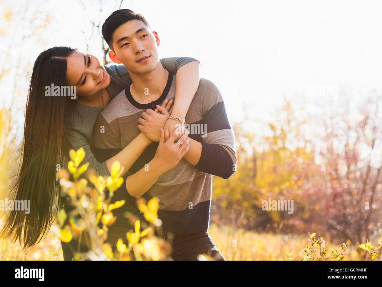 A Young Asian Couple Enjoying A Romantic Time Together Outdoors In A ...