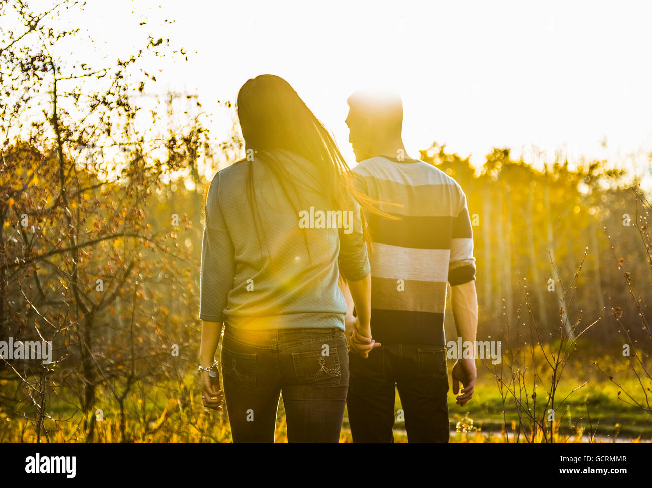 Asian couple holding hands hi-res stock photography and images - Alamy
