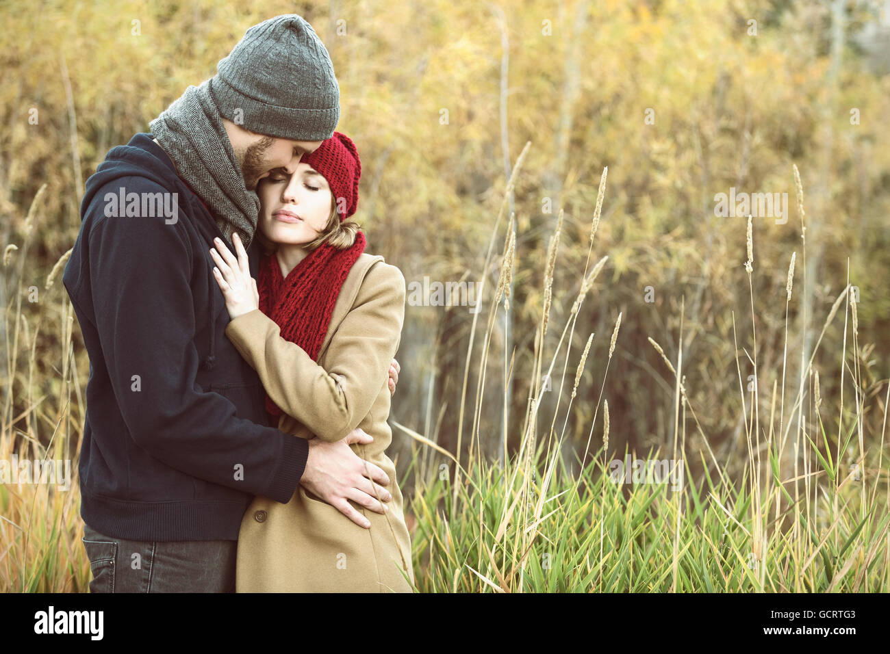 A Young Couple Holding Each Other Closely In A City Park In Autumn Edmonton Alberta Canada