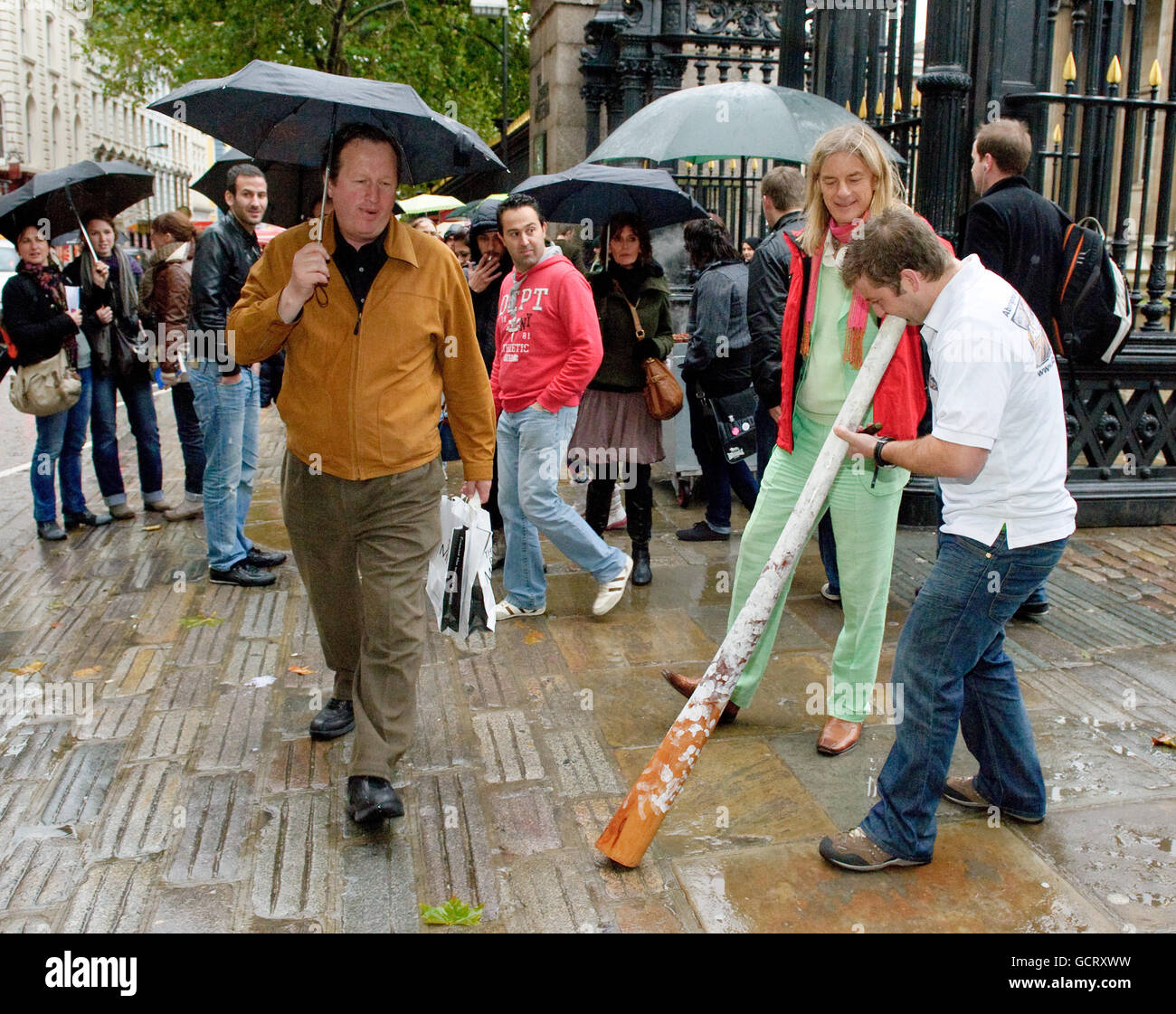 Ian White, an Australian herbalist, is welcomed at the British Museum in London by Steve Heath of the London Didgeridoo Club ahead of his lecture when he will be urging British people to try Australian Bush Flower Essences instead of anti-depressants. Stock Photo