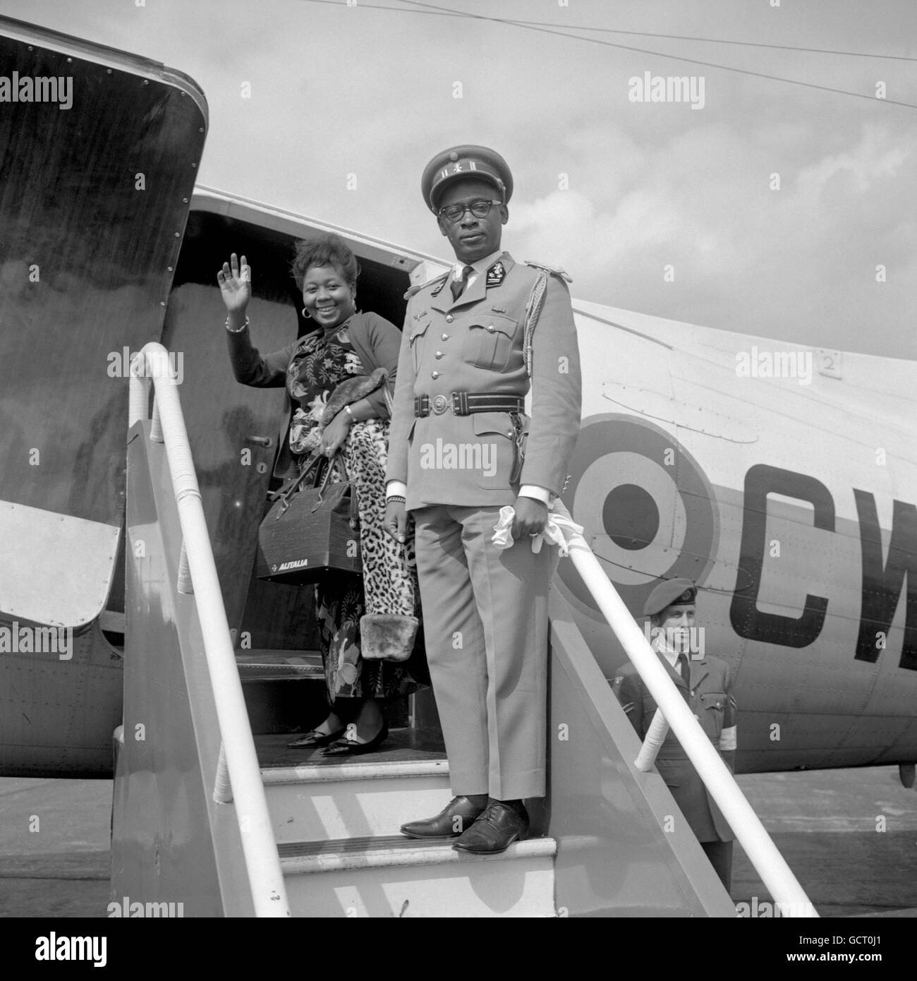 General Joseph-Desire Mobutu, Commander-in-Chief of the Congolese National Army, and his wife, board a Belgian military aircraft at Northolt Airport to fly to Brussels. Stock Photo