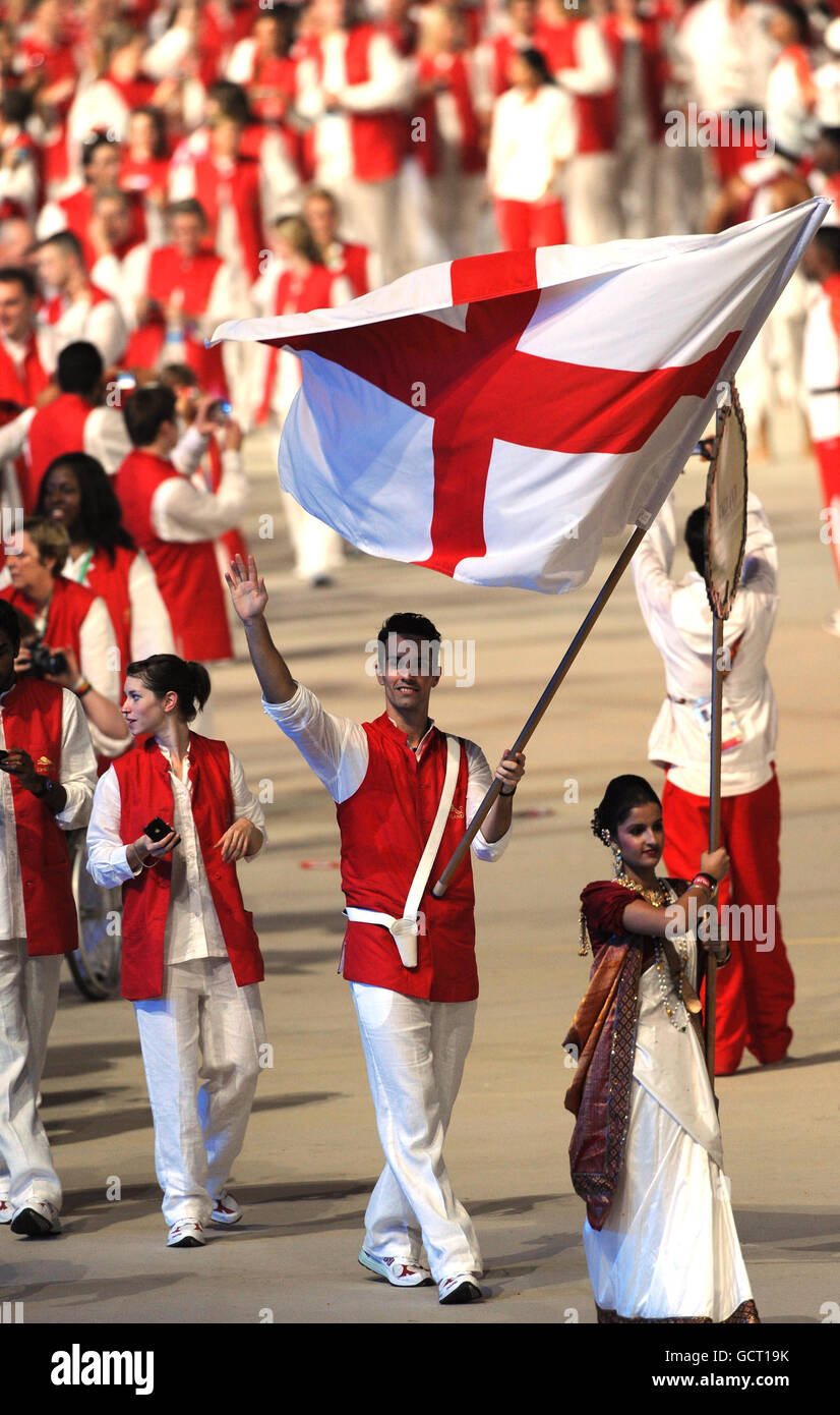 England's Nathan Robertson carries the flag during the 2010 Commonwealth Games opening ceremony at the Jawaharlal Nehru Stadium in New Delhi, India. Stock Photo