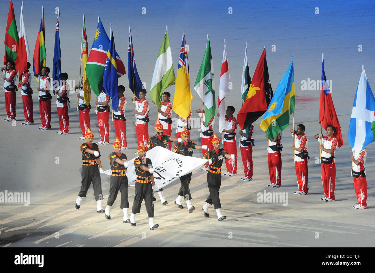 The Commonwealth flag is brought into the stadium during the 2010 Commonwealth Games opening ceremony at the Jawaharlal Nehru Stadium in New Delhi, India. Stock Photo