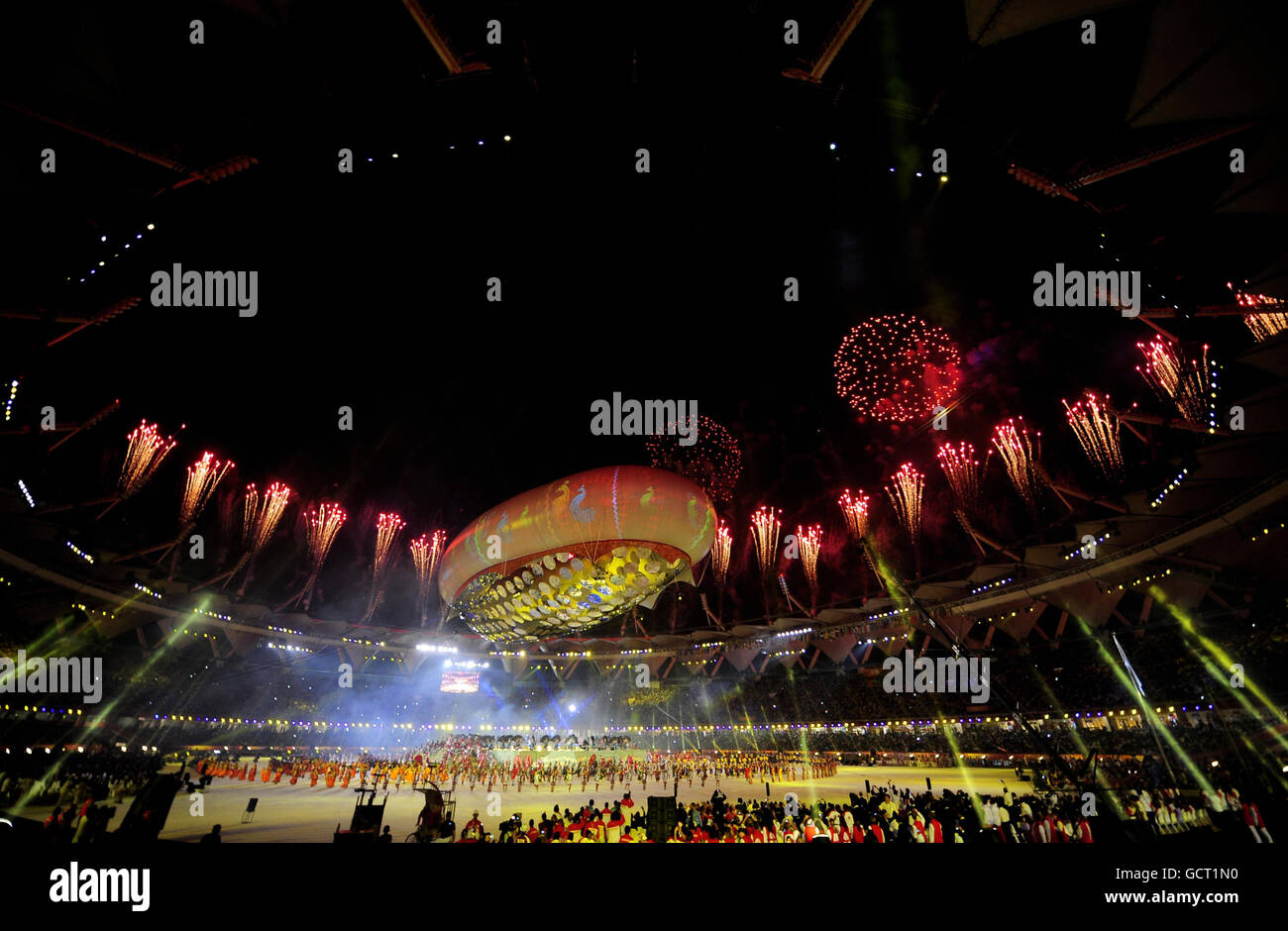Fireworks light up the stadium at the end of the 2010 Commonwealth Games opening ceremony at the Jawaharlal Nehru Stadium in New Delhi, India. Stock Photo