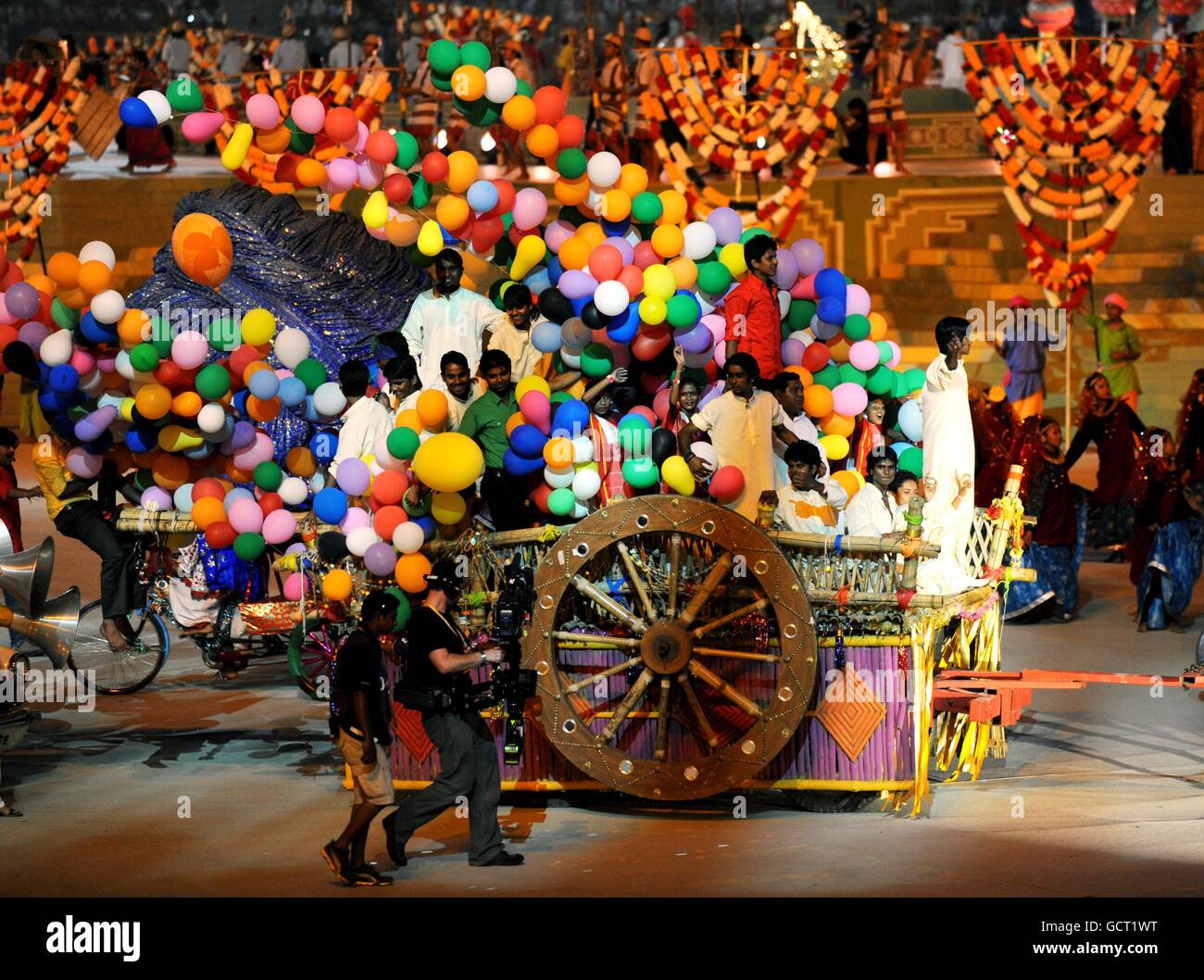 Performers on a float during the Opening Ceremony at the Jawaharlal Nehru Stadium in New Delhi, India. Stock Photo