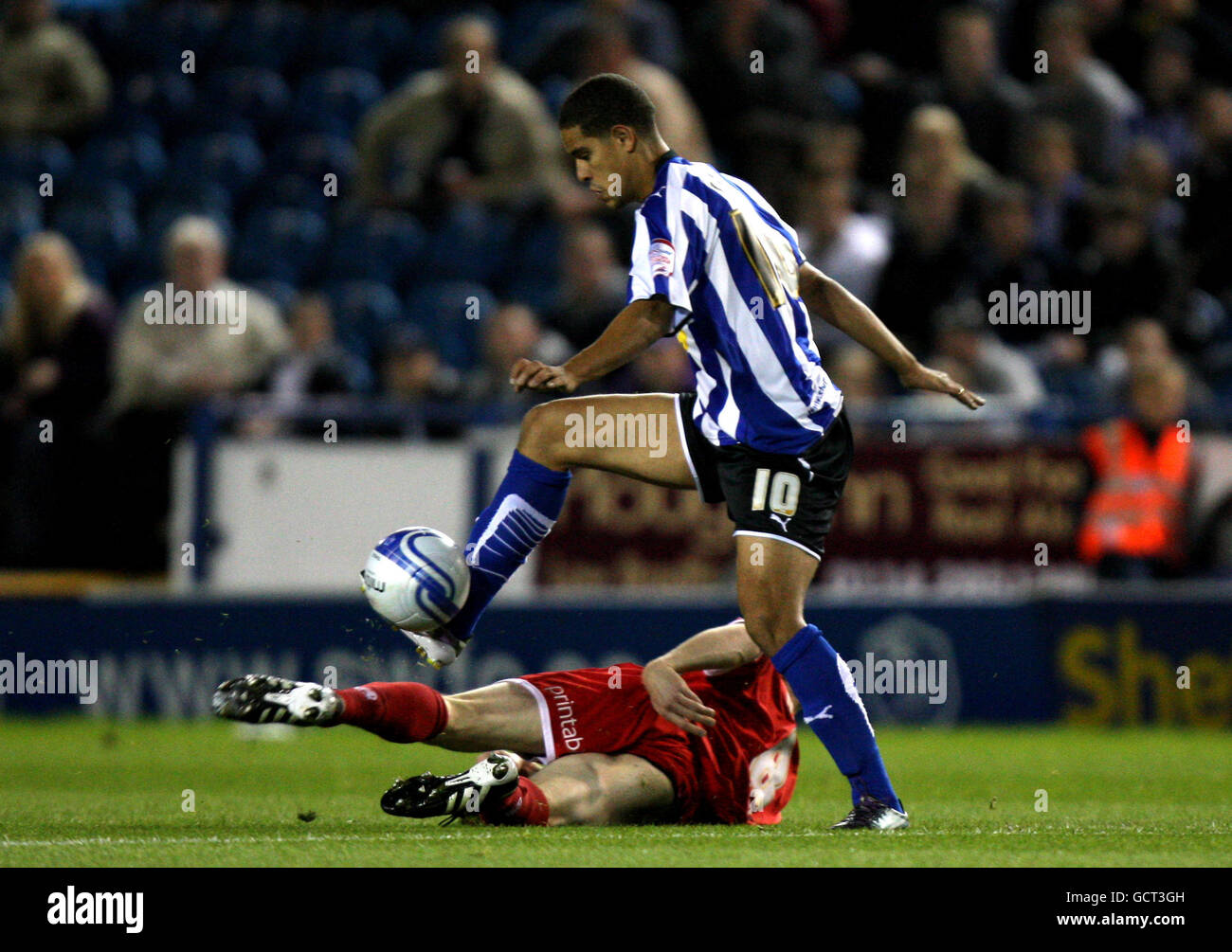 Sheffield Wednesday's Giles Coke is tackled by Chesterfield's Derek Niven Stock Photo