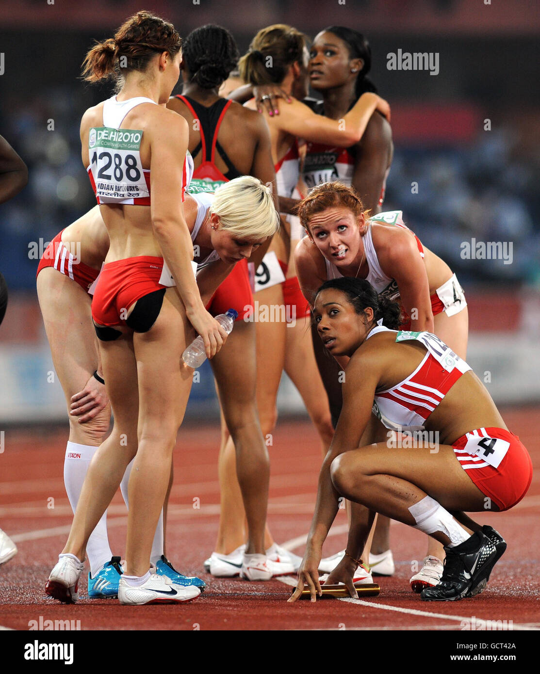 The England team stand dejected after the Women's 4x400m Relay Final