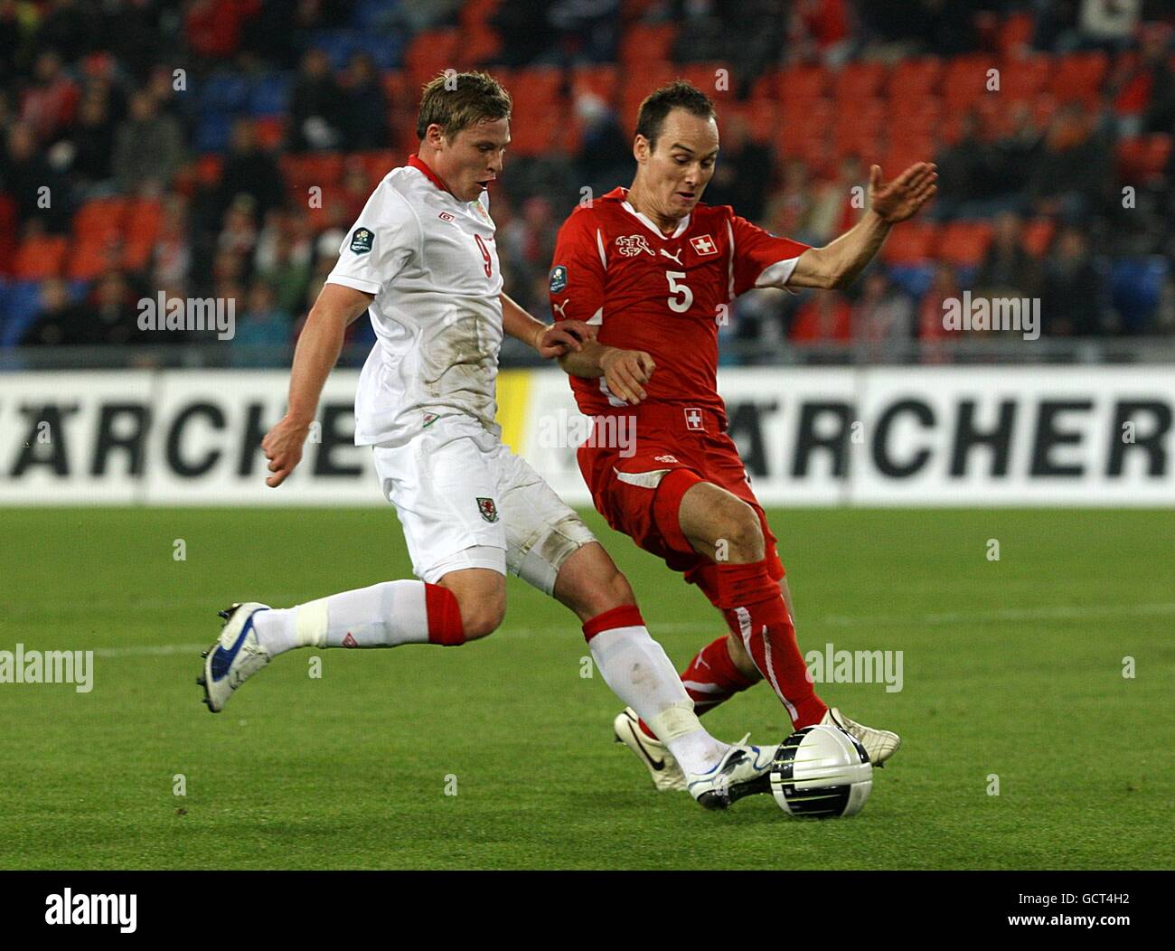 Wales' Simon Church (left) and Switzerland's Steve Von Bergen battle for the ball Stock Photo