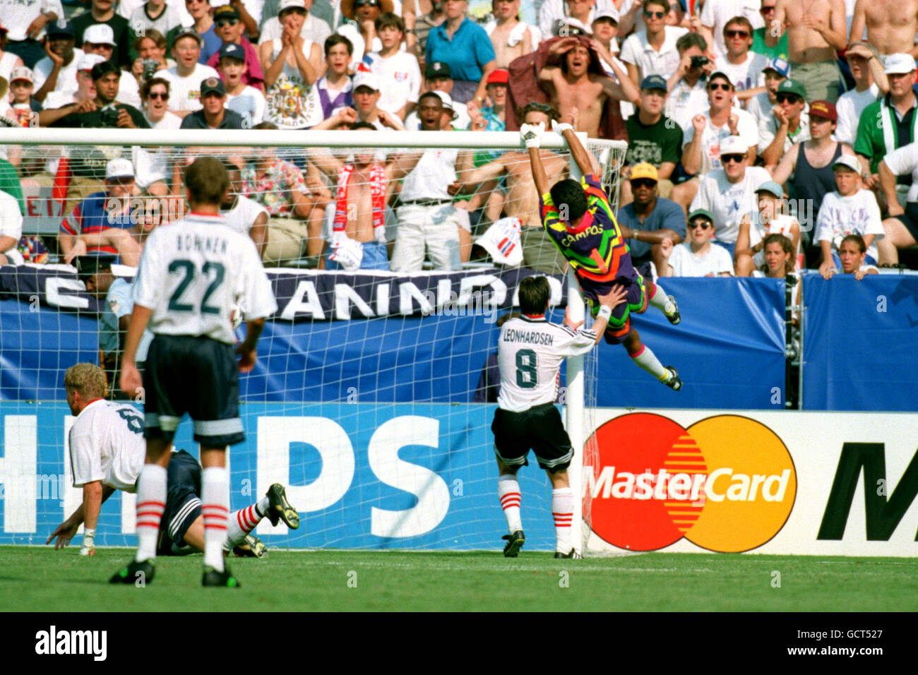 Soccer - World Cup USA 94 - Group E - Mexico v Ireland. Jorge Campos, Mexico goalkeeper, swings on the cross bar Stock Photo