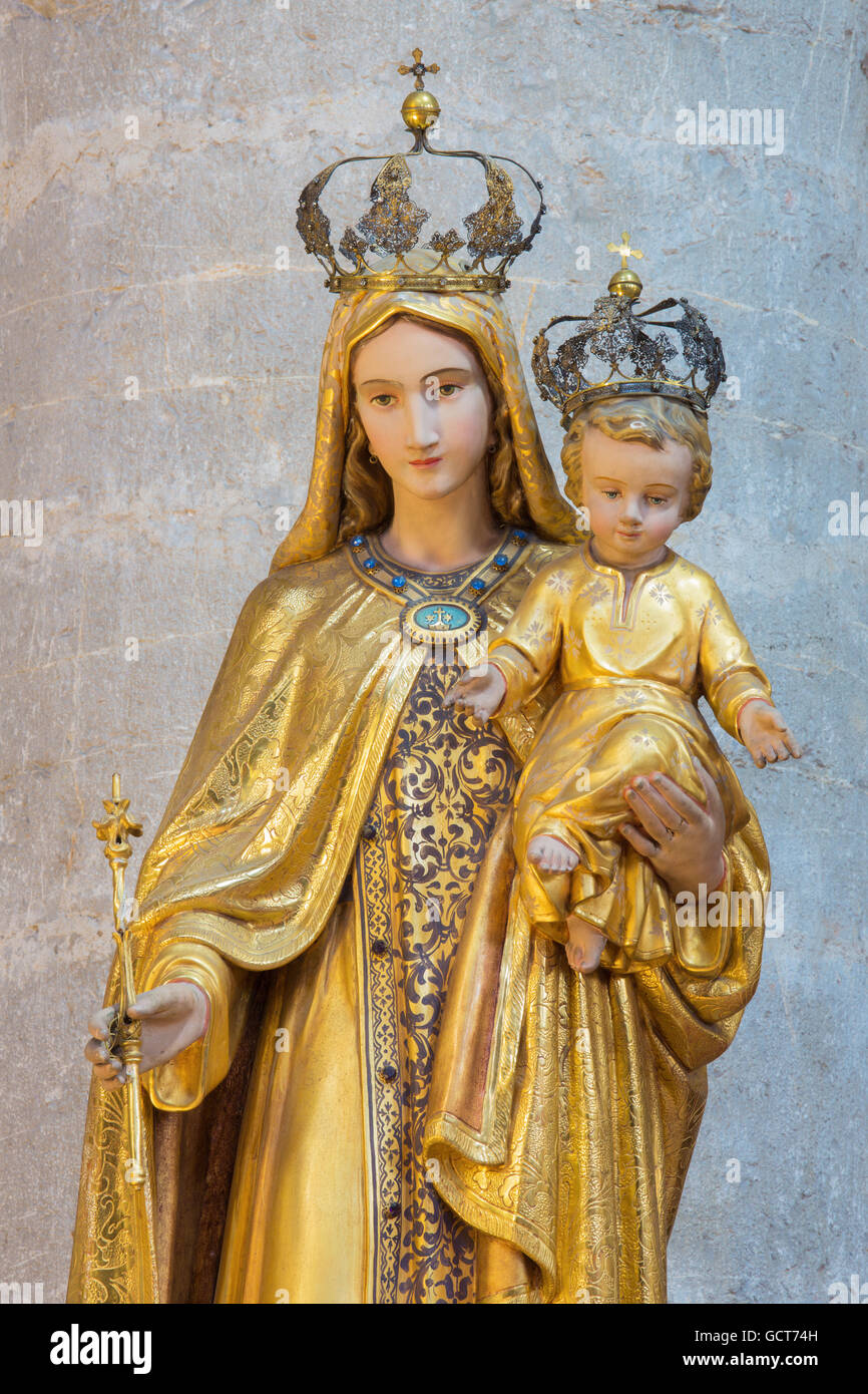 BRESCIA, ITALY - MAY 23, 2016: The carved polychrome statue of Madonna in church Chiesa di Santa Maria del Carmine Stock Photo