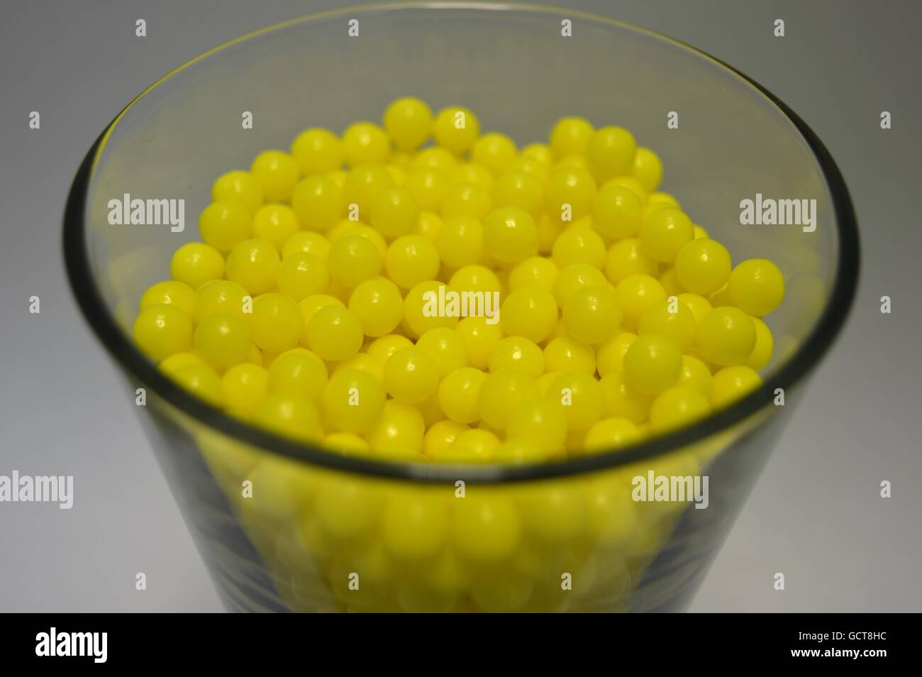 Yellow balls in the glass Stock Photo Alamy
