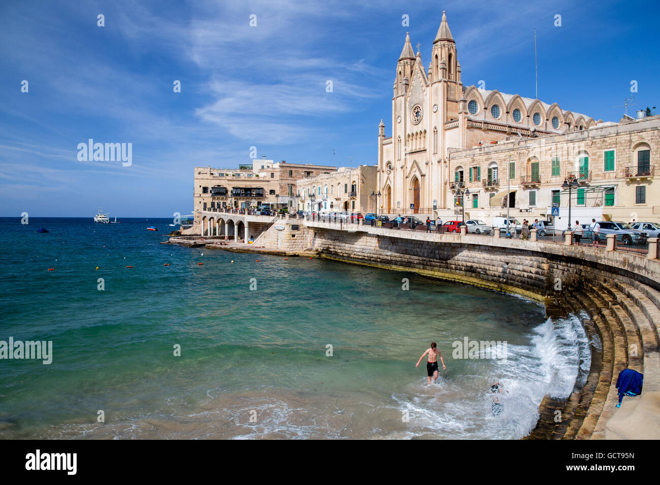 Balluta Bay area of St.Julian's Bay and Church of Our Lady of Mount Carmel, Malta Stock Photo