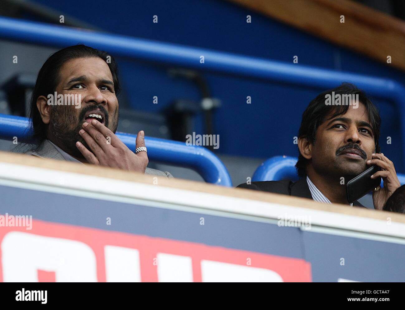 Soccer - Barclays Premier League - Blackburn Rovers v Chelsea - Ewood Park. Venky's Managing Director Mr B.Balaji Rao (left) and Mr B.Venkatesh Rao (right) in the stands Stock Photo