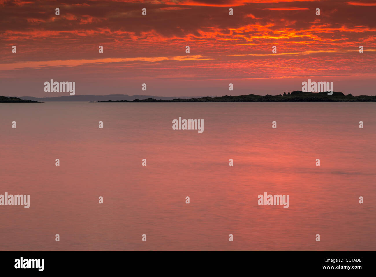 Dramatic sunset over the Islands of Fleet, Galloway, Scotland, Stock Photo