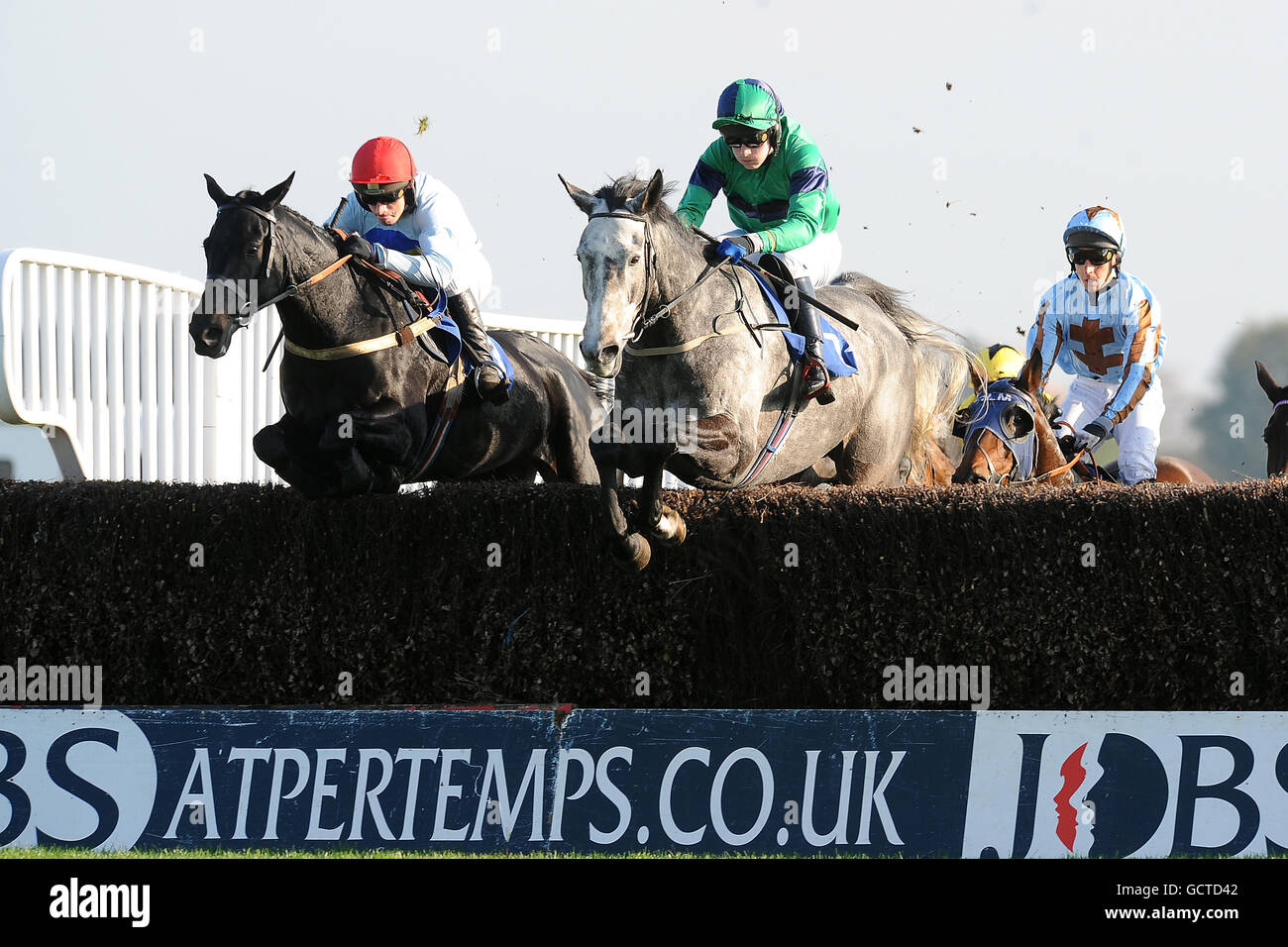 Charlie Poste Racing Jockey Charlie Poste on Solitary Palm (c) leads from Leighton Aspell on ...