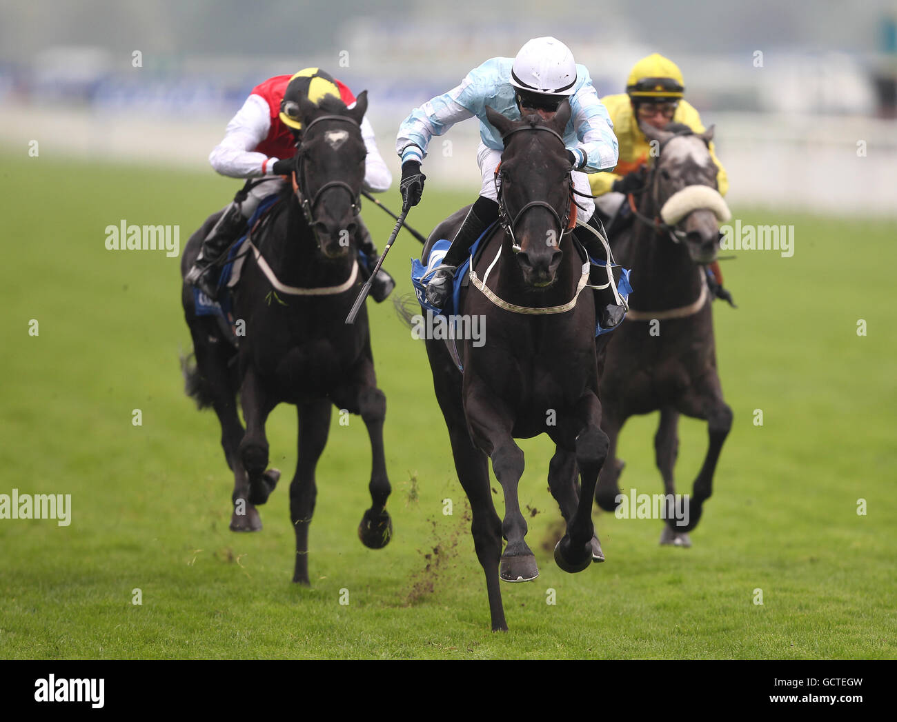Horse Racing - The Coral Sprint Trophy - York Racecourse. Act of Kalanisi ridden by Greg Fairley (light blue) wins The Coral Stakes Stock Photo