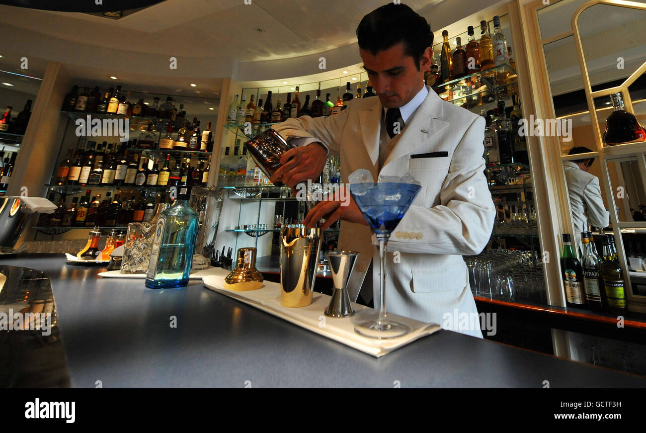 A barman mixes a cocktail in the American Bar in The Savoy Hotel in London, following a 3 year restoration of the hotel. Stock Photo