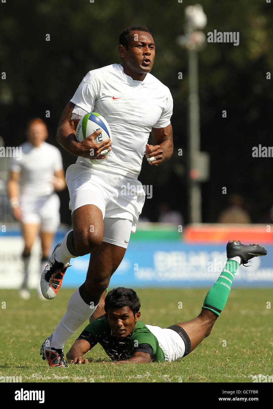 England's Iosa Damudamu runs to score a try against Sri Lanka in the Rugby 7's round of pool matches at the Delhi University Stadium in Delhi, India Stock Photo
