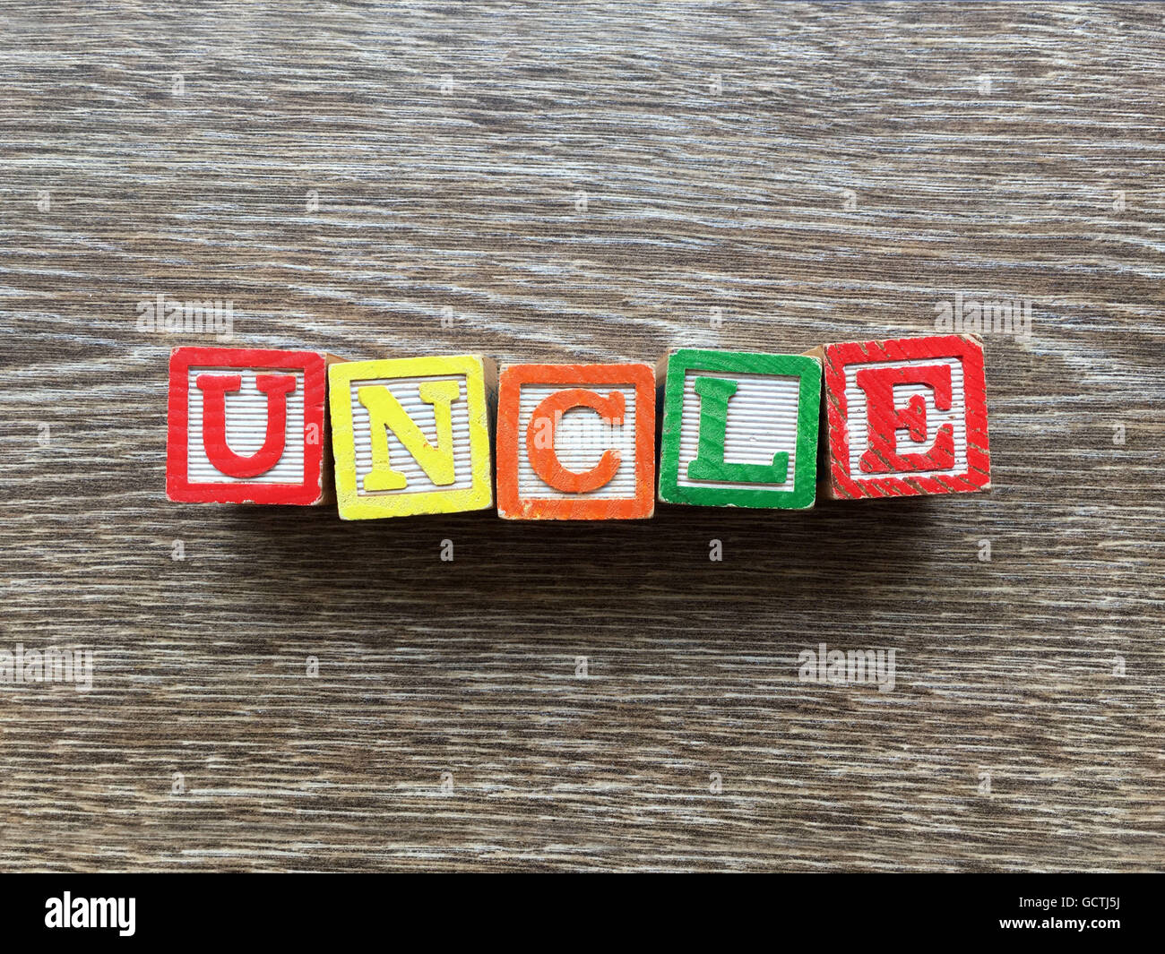 UNCLE word done with wood block letter toys Stock Photo
